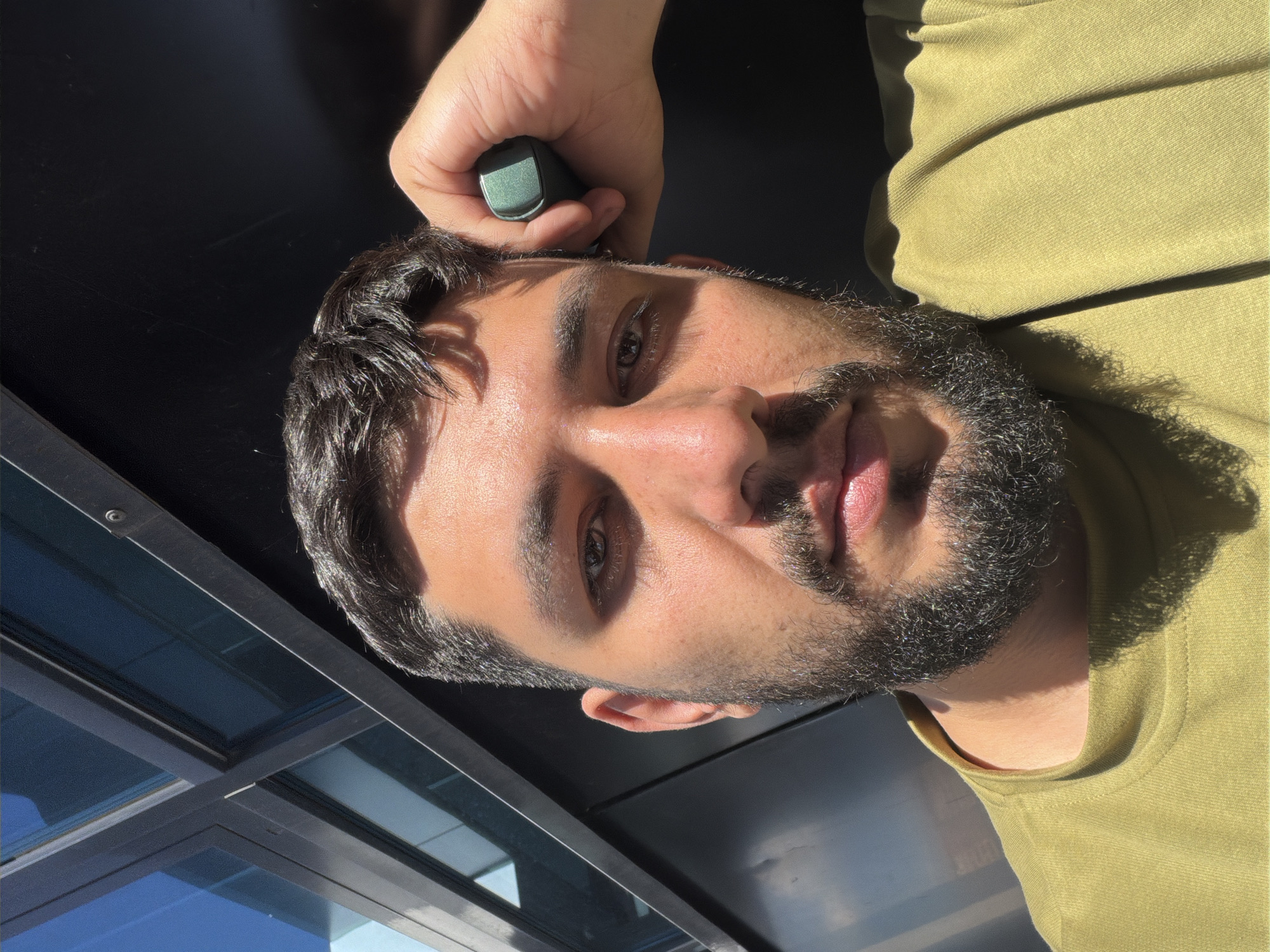 Man uses green device outdoors in Krasnoyarsk