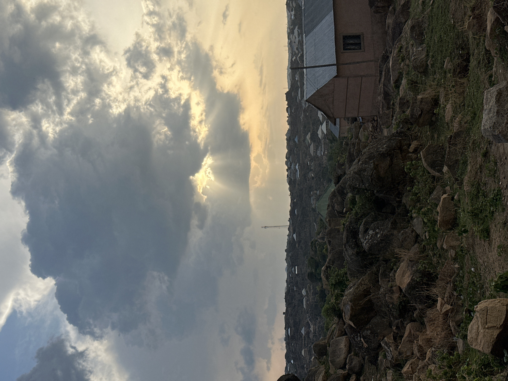 Late afternoon light illuminates Jos, Nigeria's rocky landscape