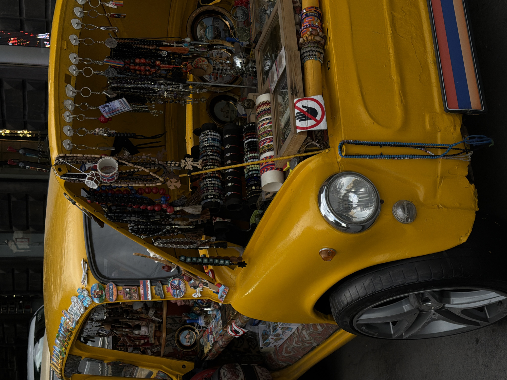 Yellow vintage vehicle operates as mobile stall
