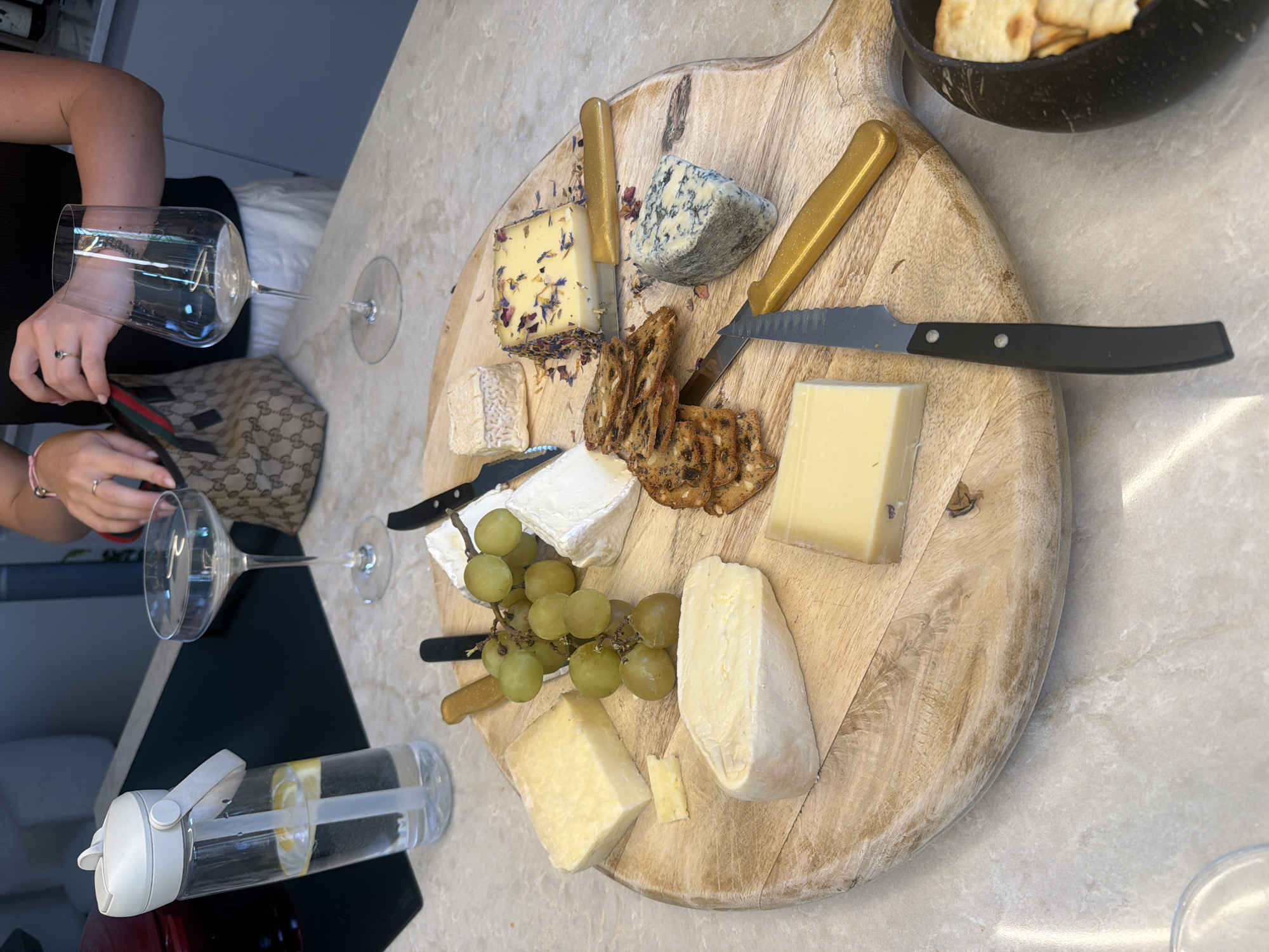 Cheese board and wine spread on a marble countertop in Ridderkerk