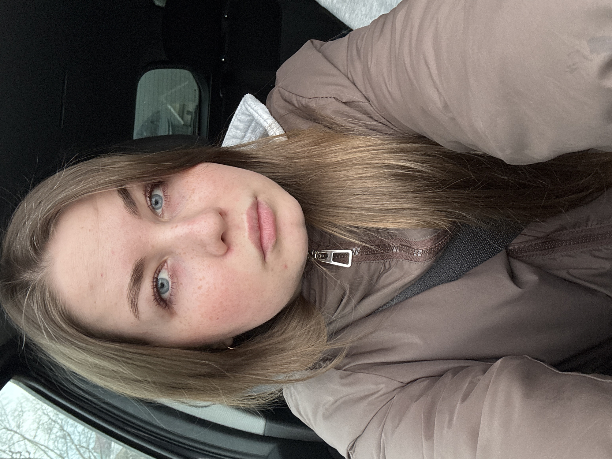 Woman takes selfie in car in Chaikovsky, Russia
