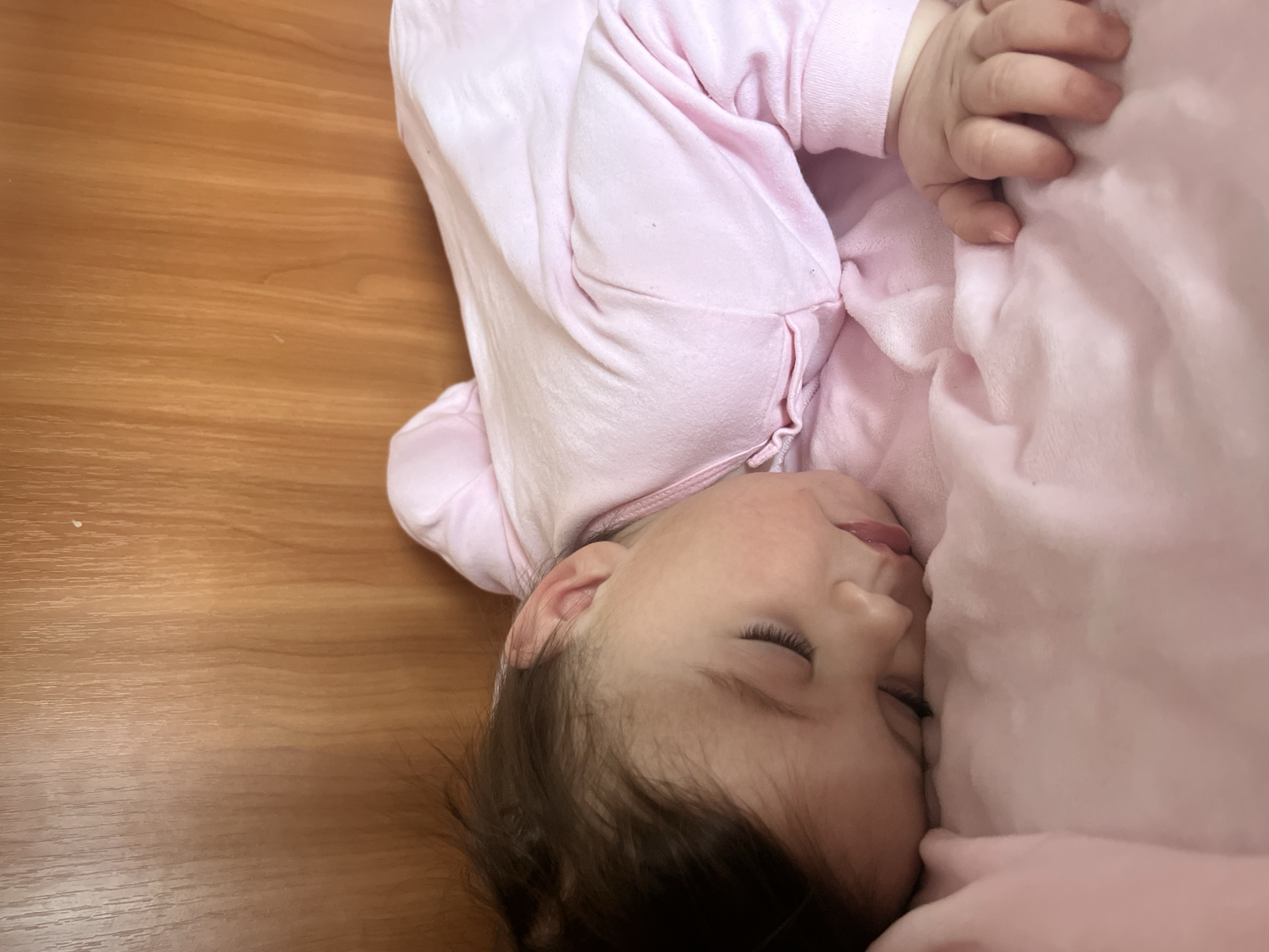 Sleeping baby in pink outfit captured in Elena, Bulgaria