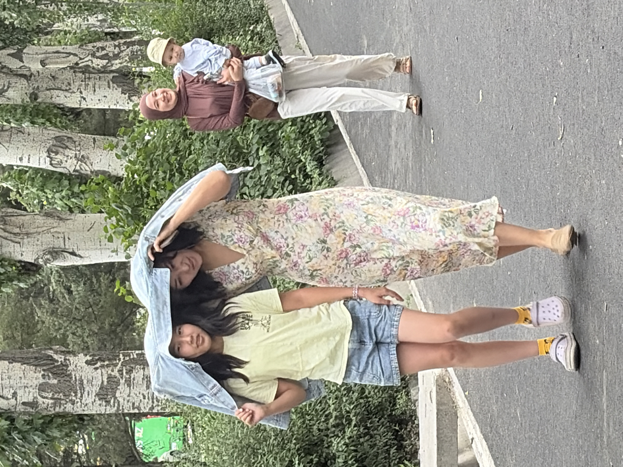 Urban daily life captured across tree-lined streets and markets