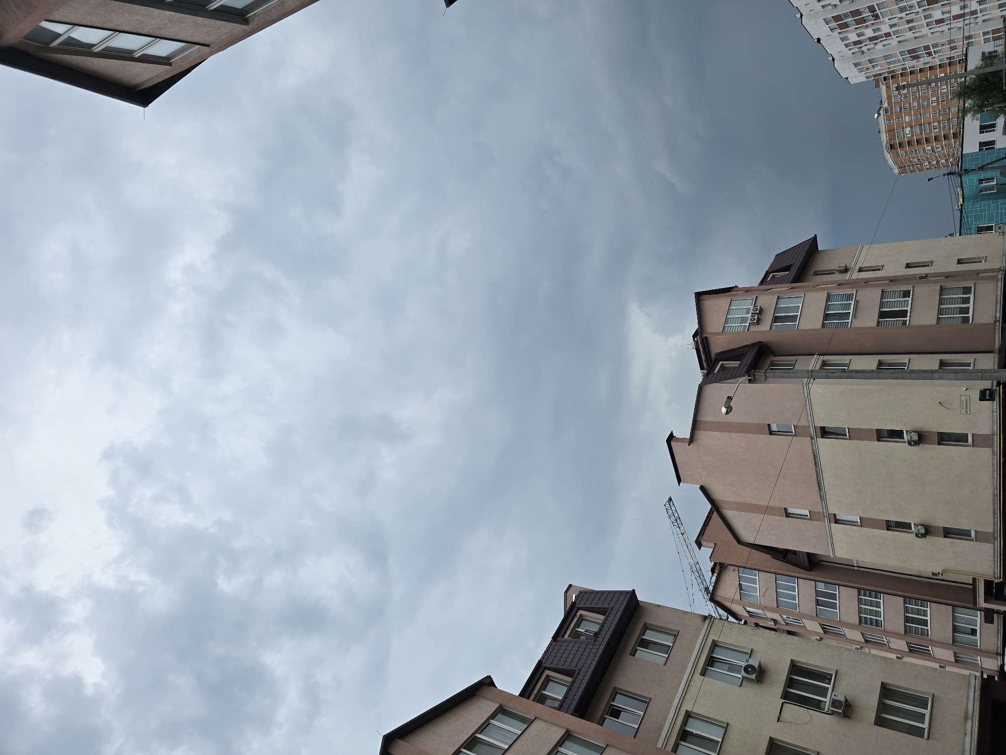 Ordinary life documented across Ukrainian suburb during rainy afternoon