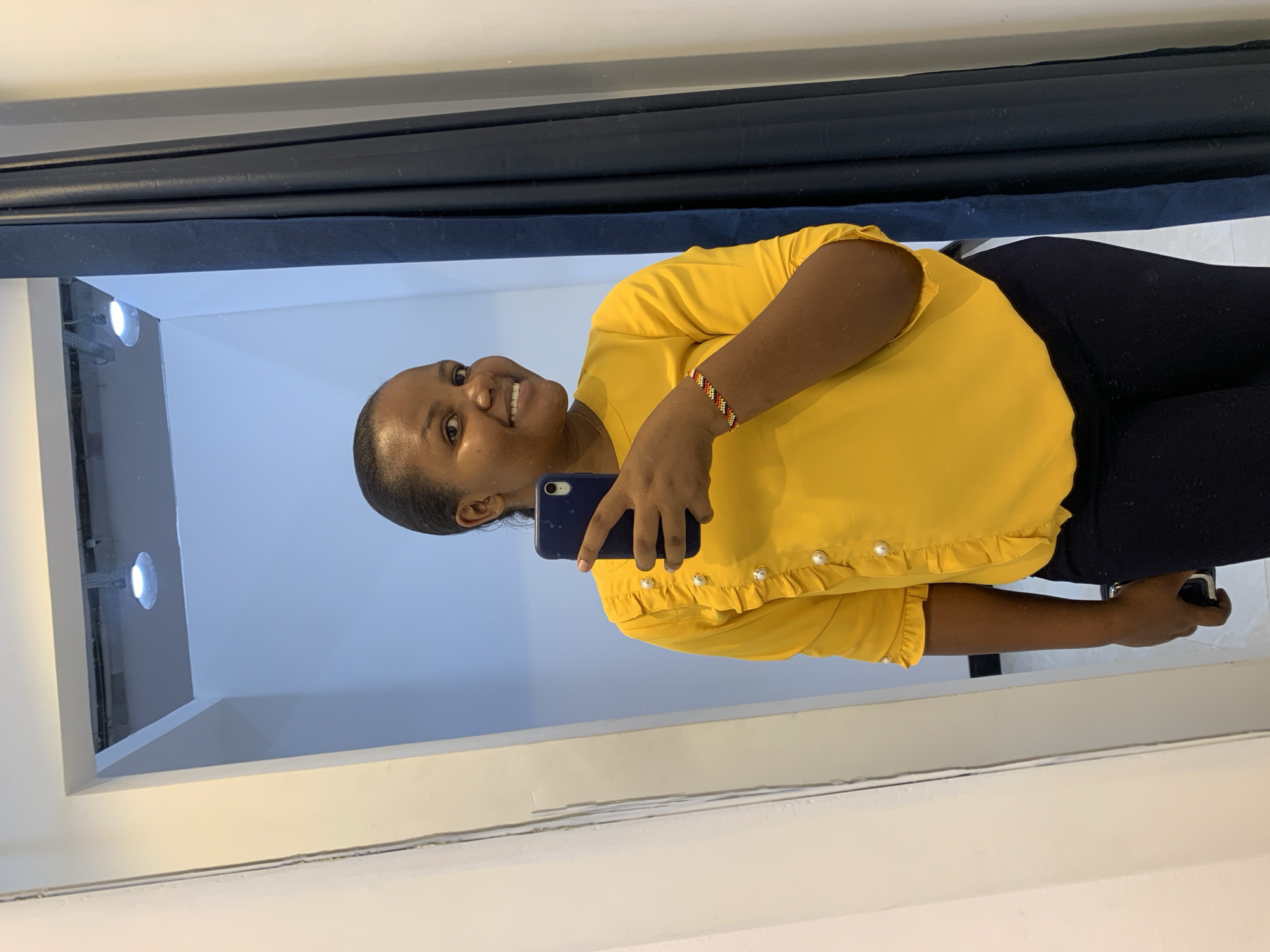 Woman takes selfies at Zara store in Dar es-Salaam