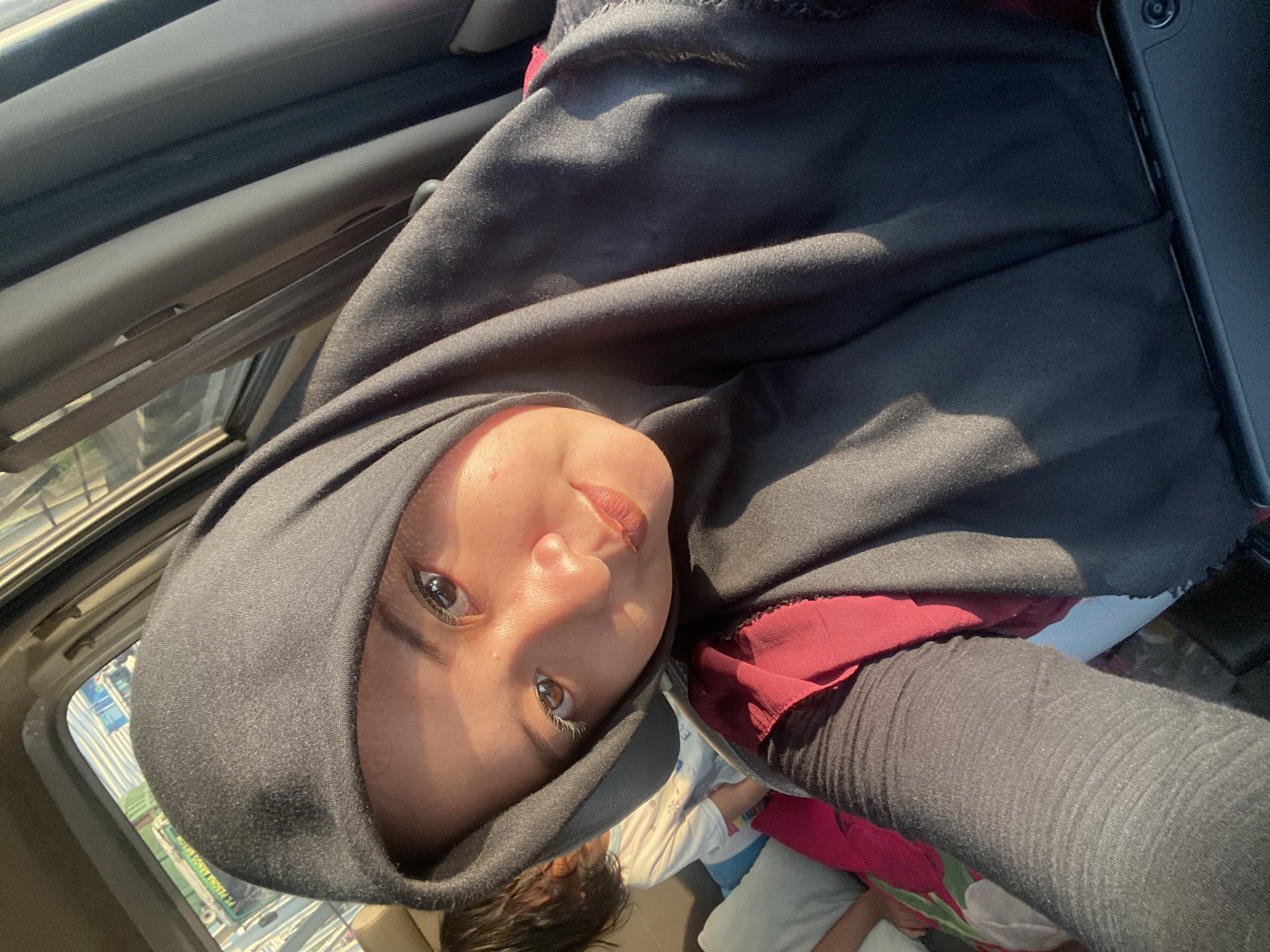 Person in hijab spotted traveling through Bangun, Indonesia