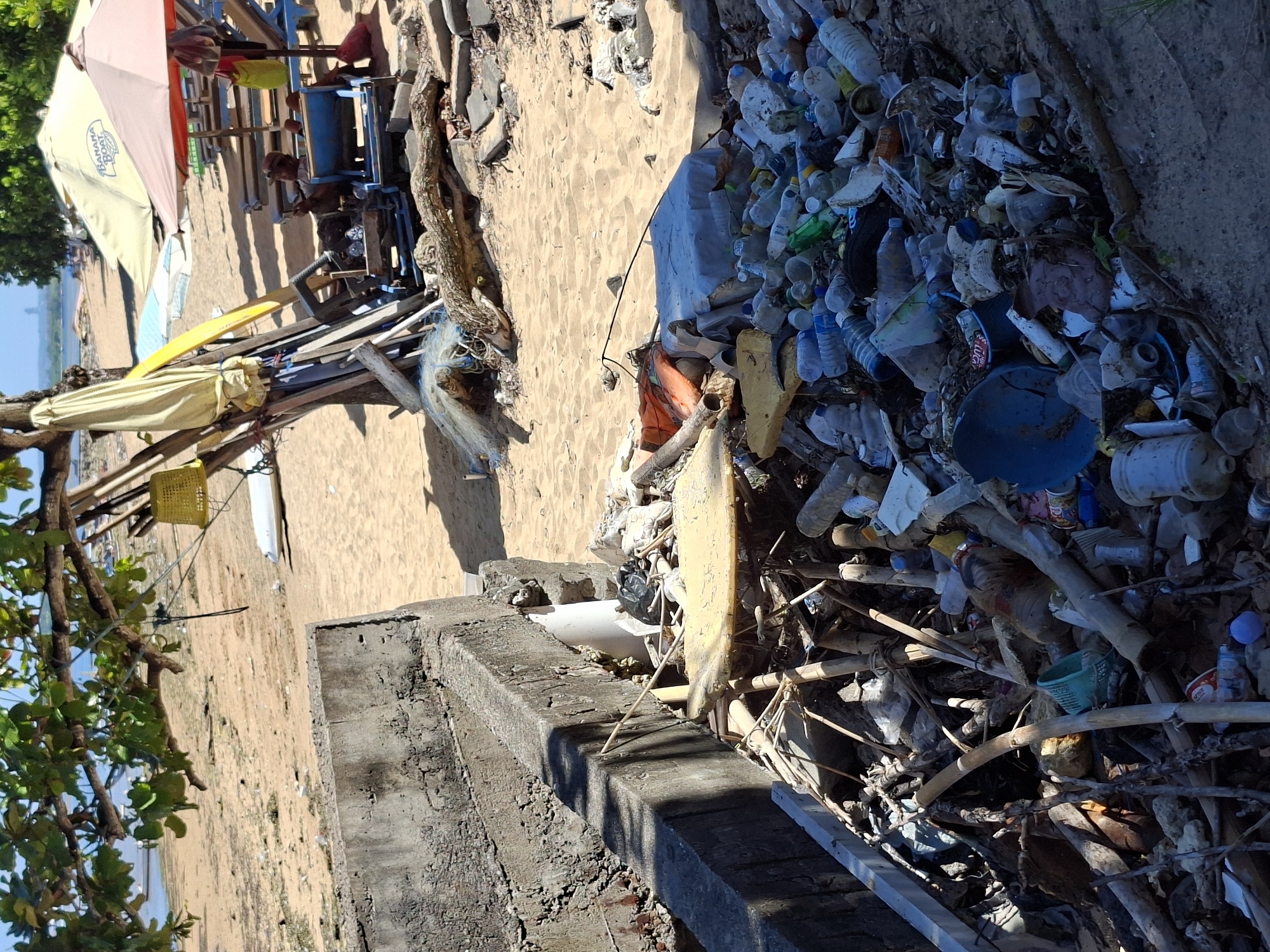 Morning scenes from Denpasar beaches show pollution, commerce, tourism