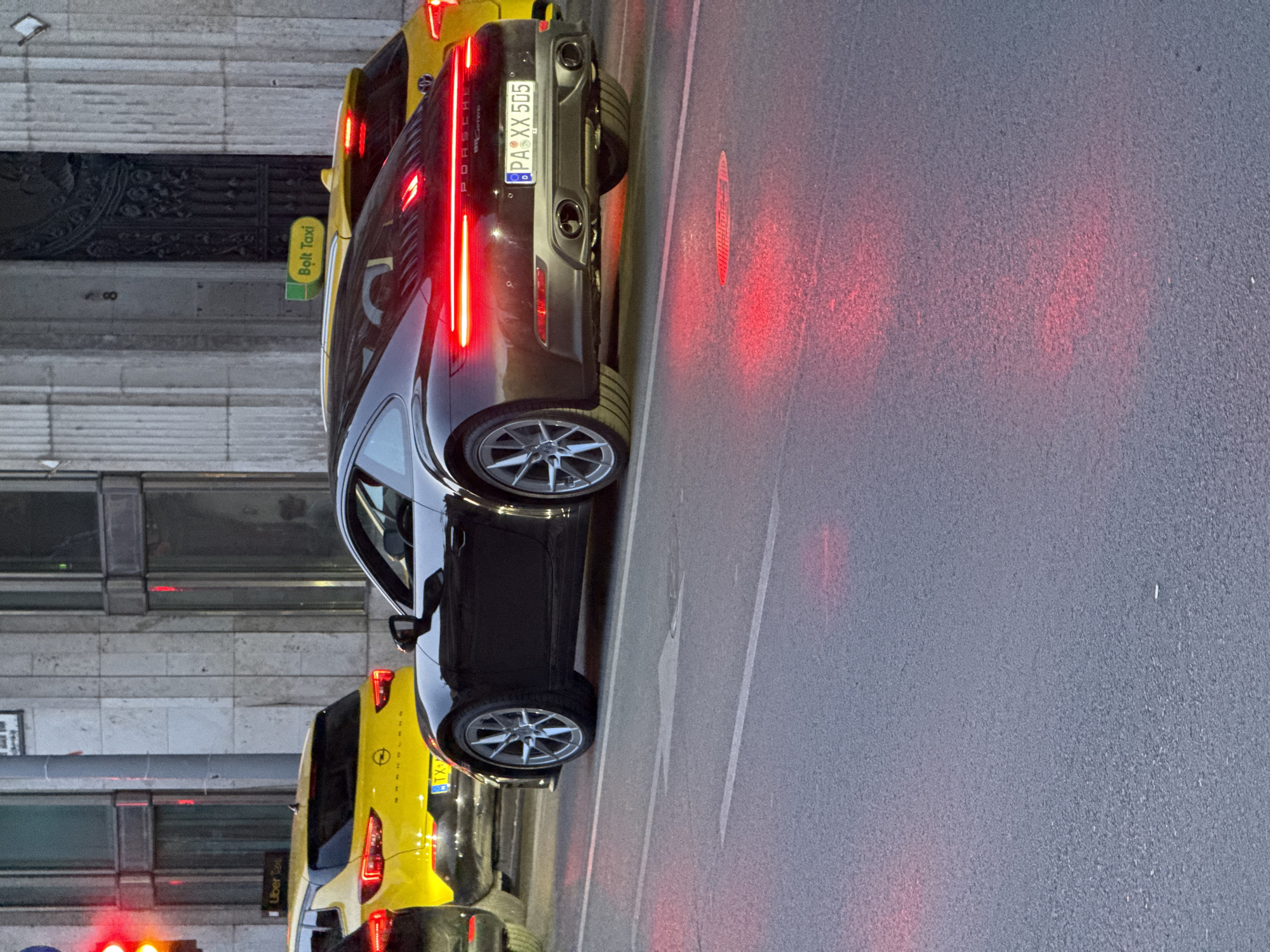 Budapest street scenes: parked luxury car and Ferris wheel captured