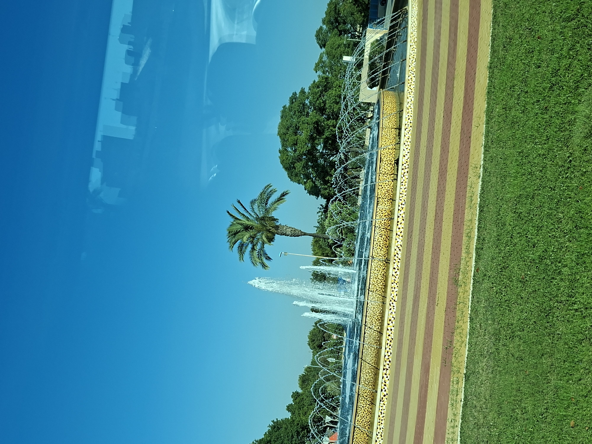 Sunny morning at a fountain park in Guardamar del Segura
