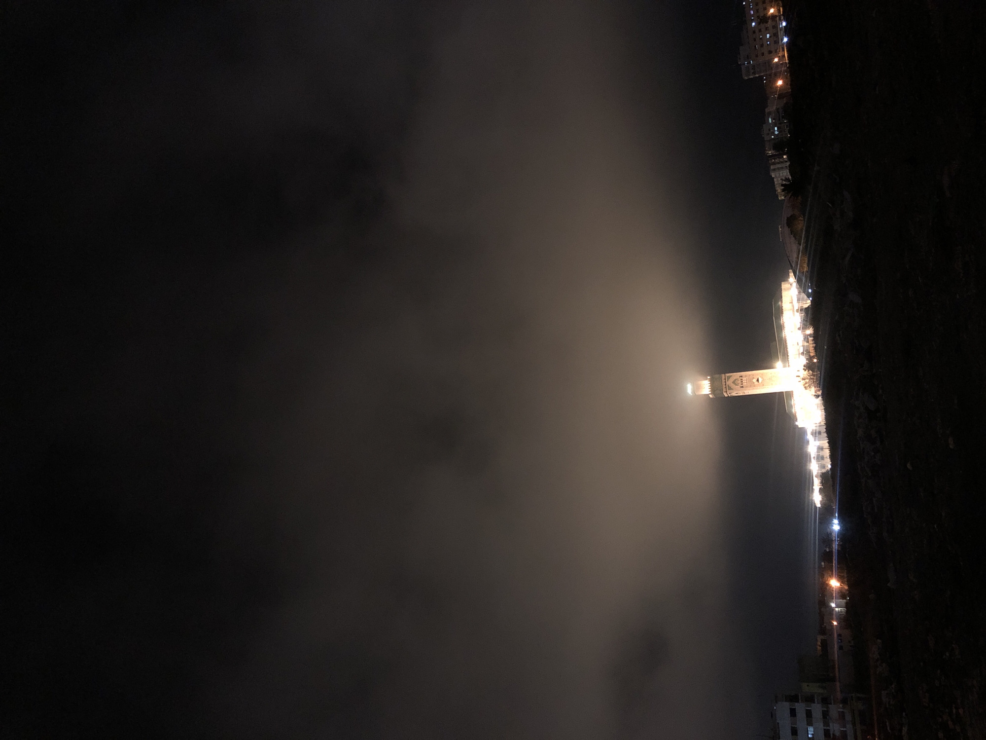 Hassan II Mosque shrouded in nighttime fog, Casablanca
