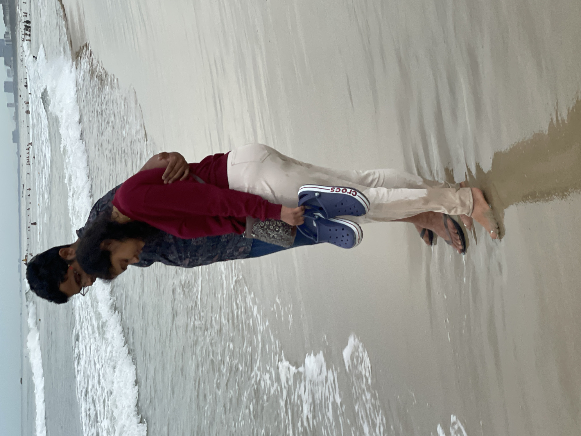Cloudy day on Da Nang's beach, crowds in the surf