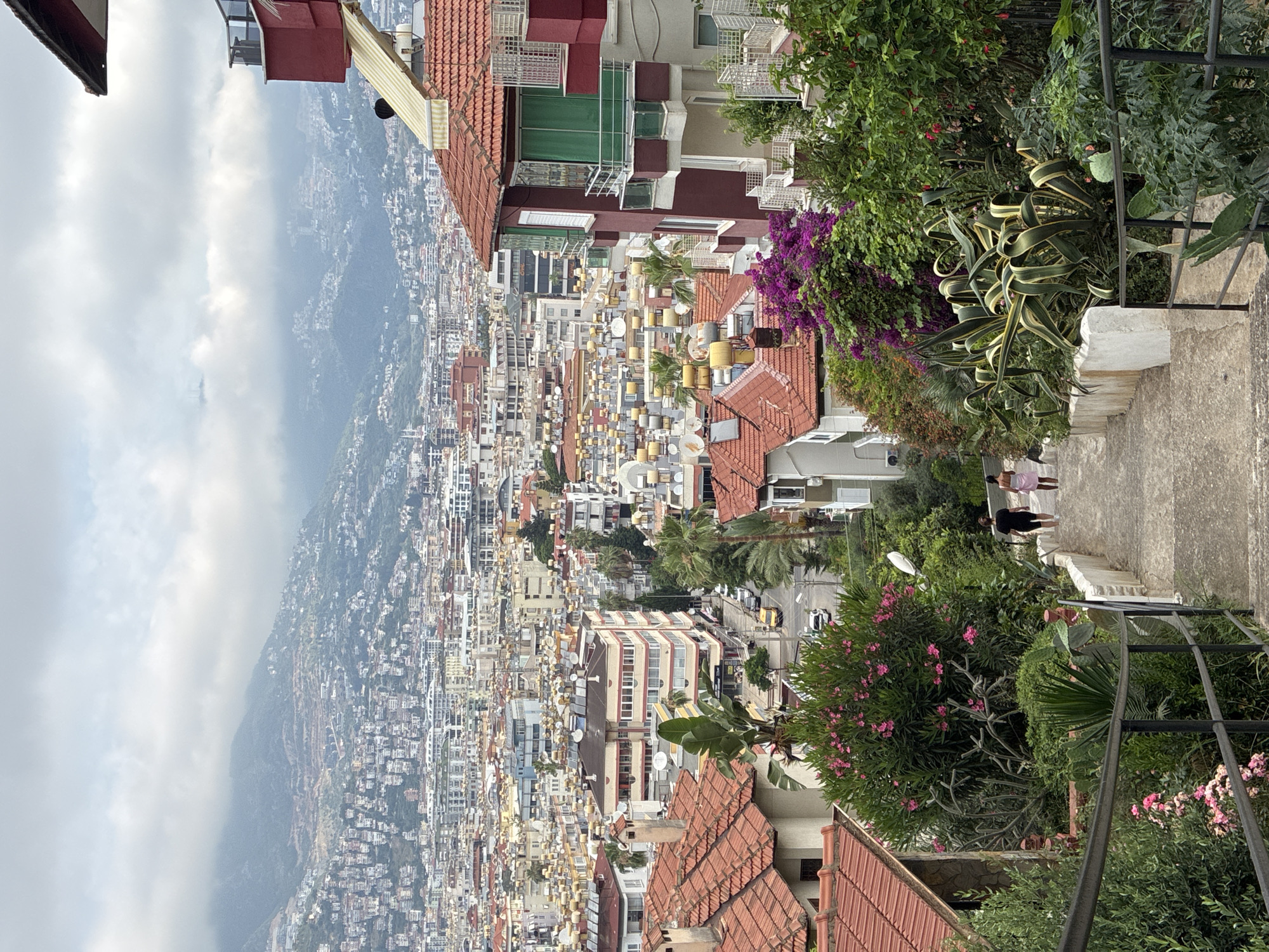 Tourist captures scenic views of Alanya cityscape and cable cars