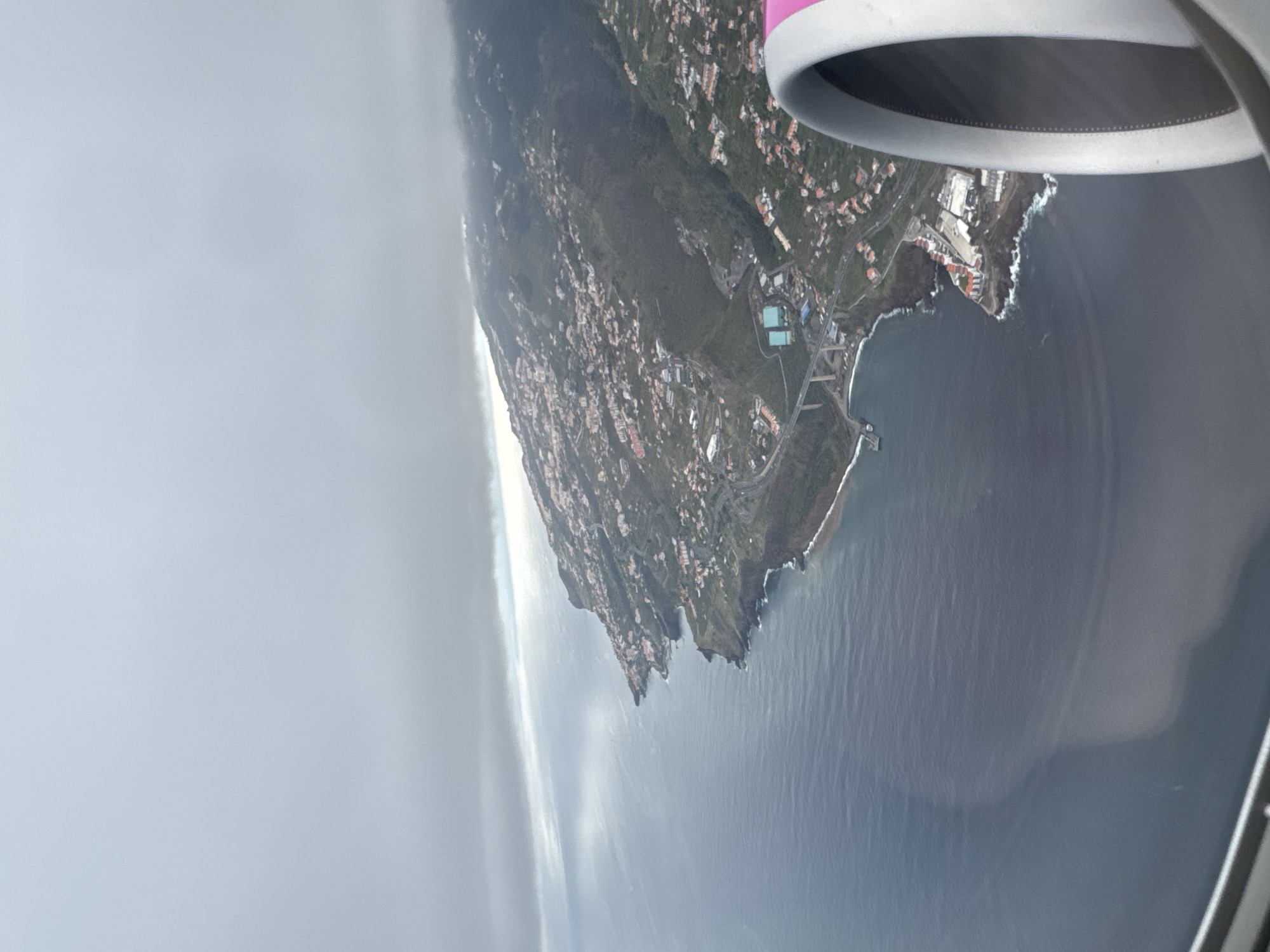 Aerial view captures Santa Cruz Portugal coastline from airplane