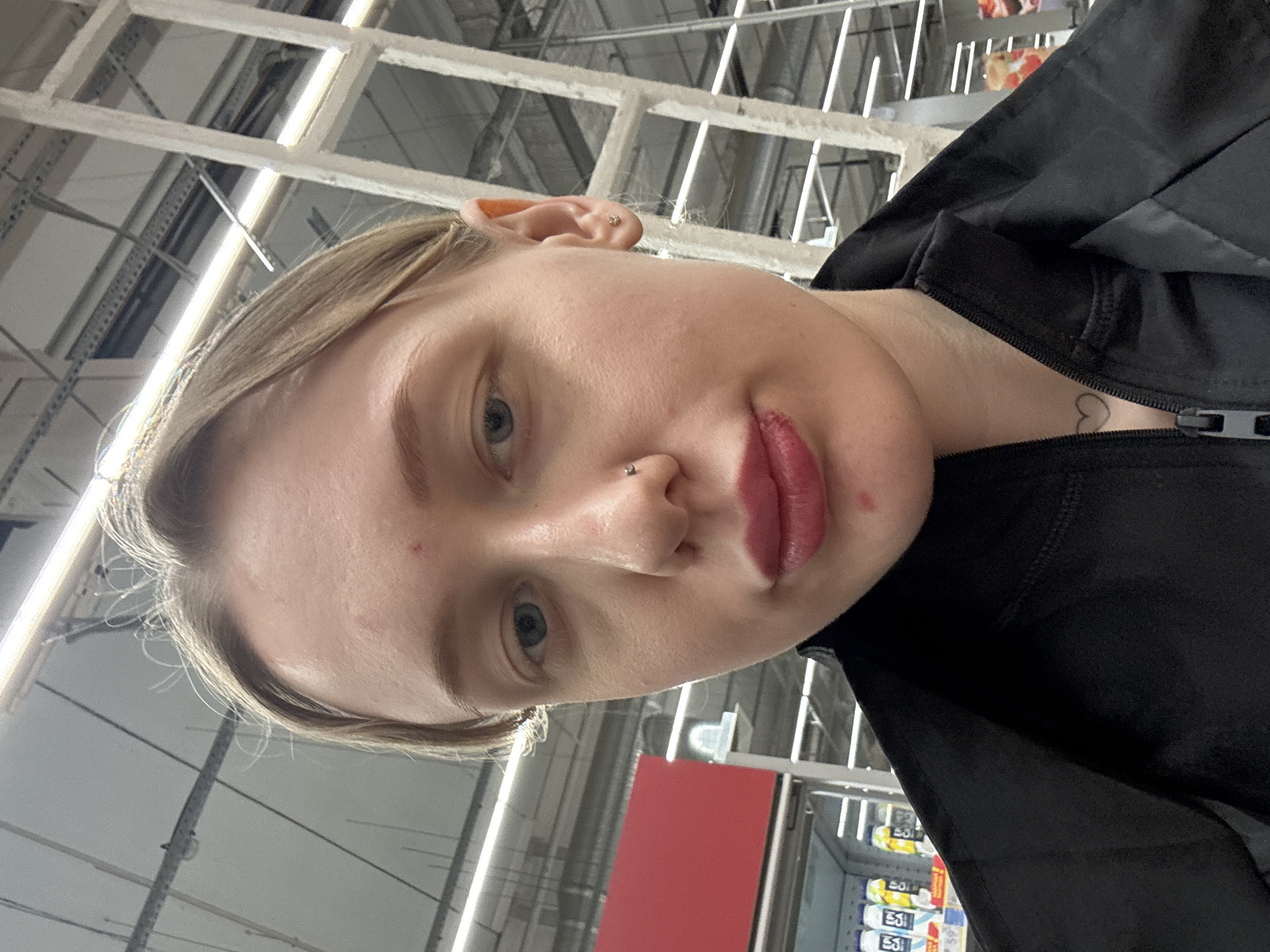 Person takes multiple selfies at commercial venue in Rostov-on-Don