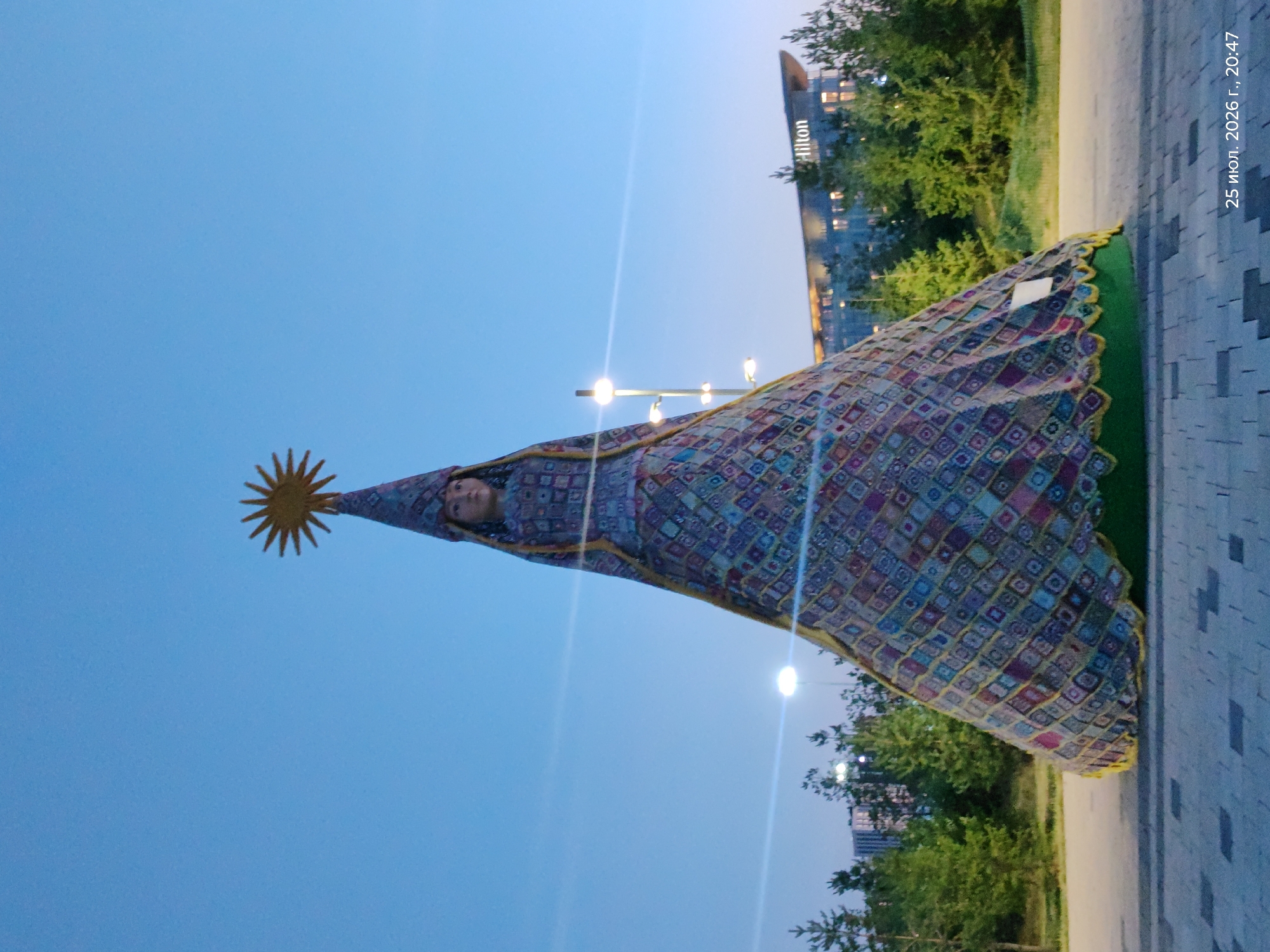 Astana landmarks and fountains lit up at dusk