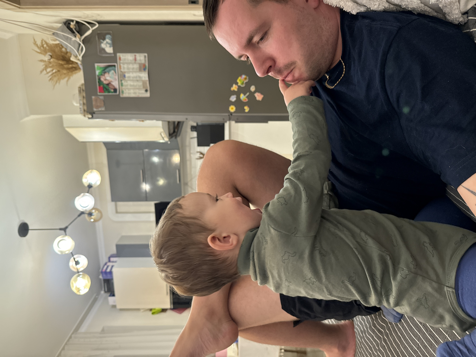 Father and child share tender moment in Odintsovo home