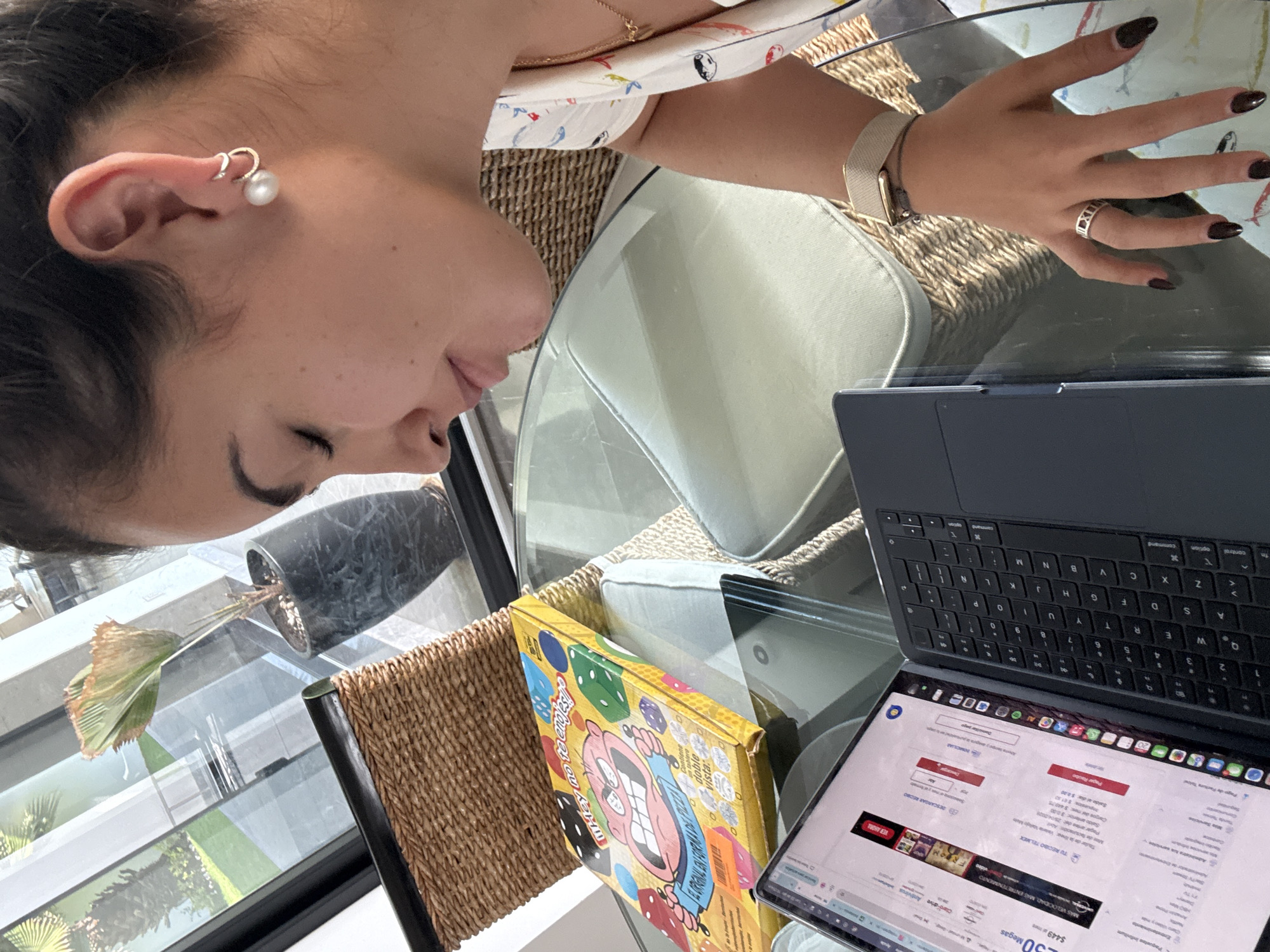 Person uses MacBook to browse Telmex website in Mexico