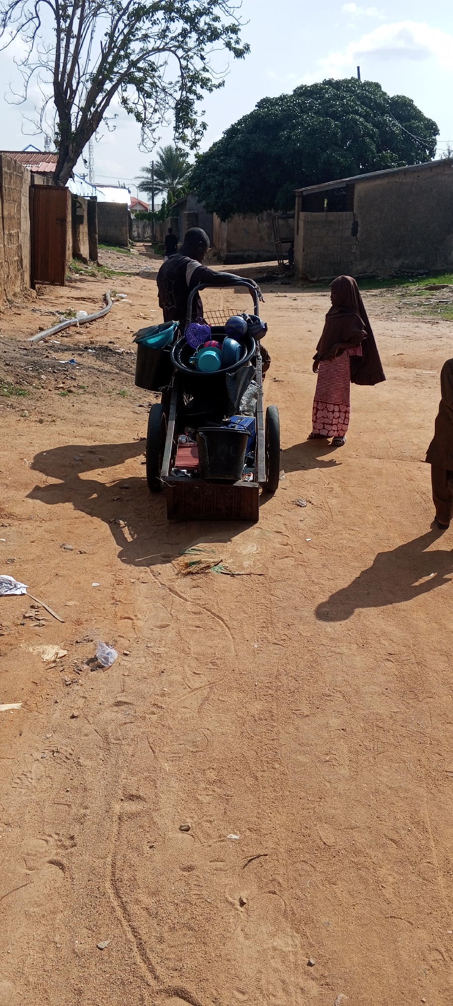 Everyday street life across Jalingo's dusty residential neighborhoods