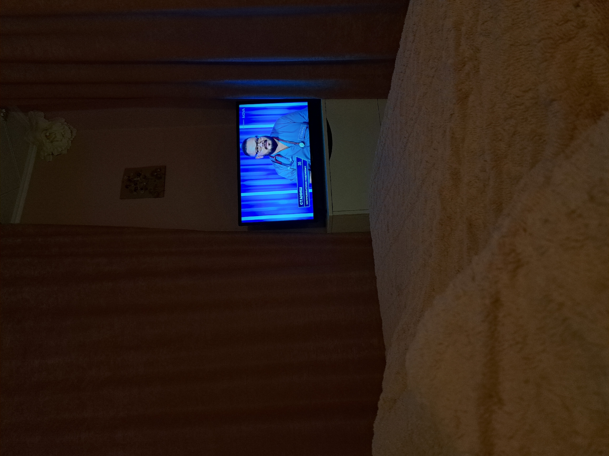 Healthcare professional appears on television in Bulgarian home