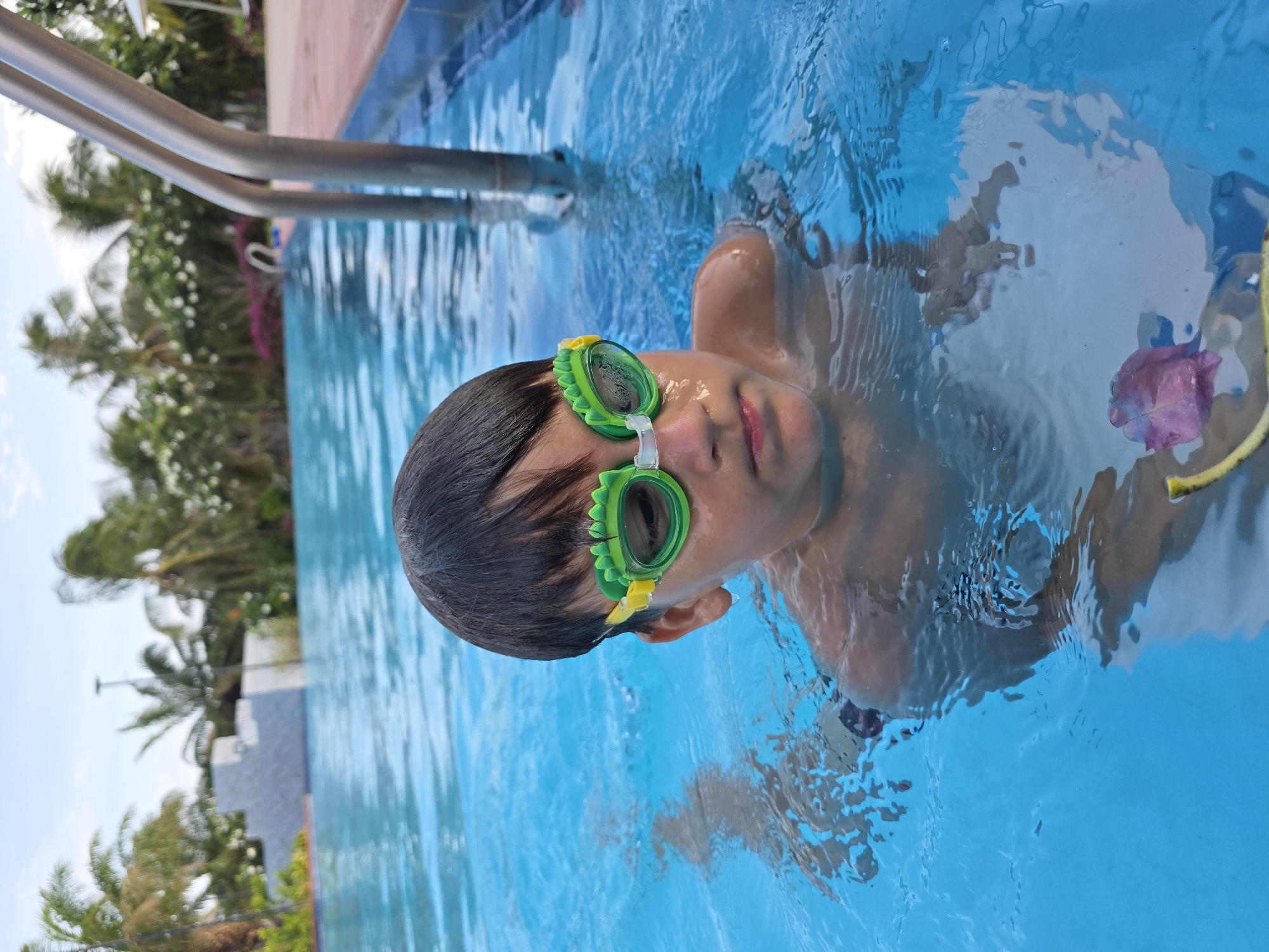 Children swimming at Phu Thuy Ward pool Vietnam
