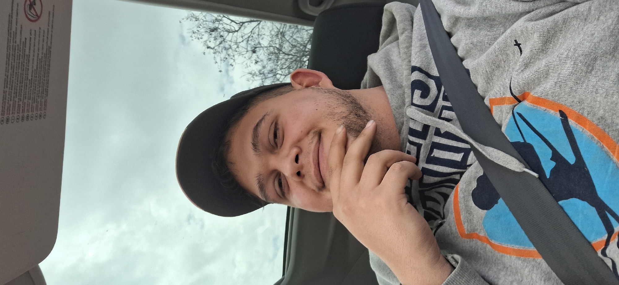 Car passenger captured in relaxed pose during drive in Varna