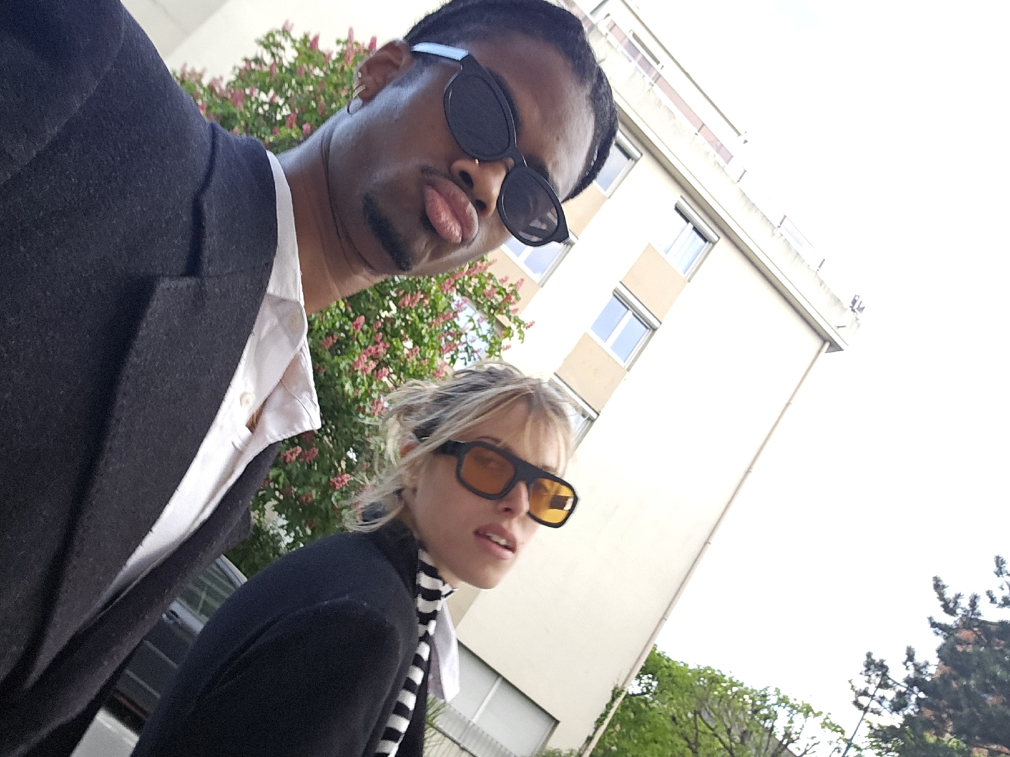 Two people photographed in Pantin elevator and outdoors Sunday