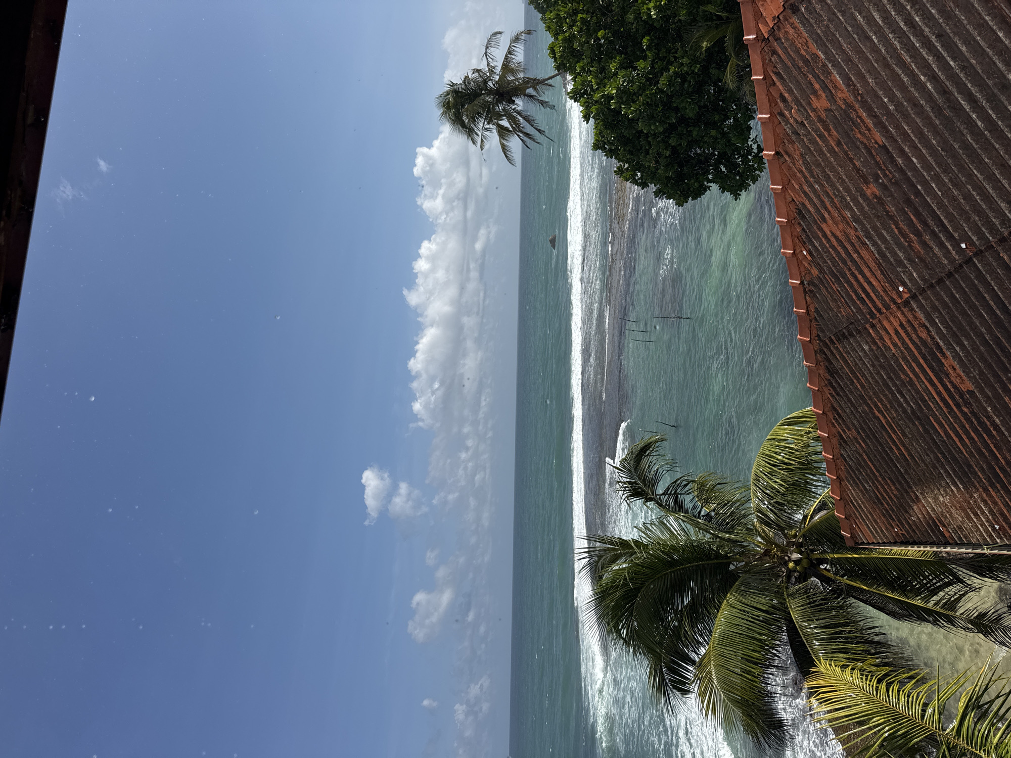 Morning on the Sri Lankan coast: rain, fishing boats, and a meal