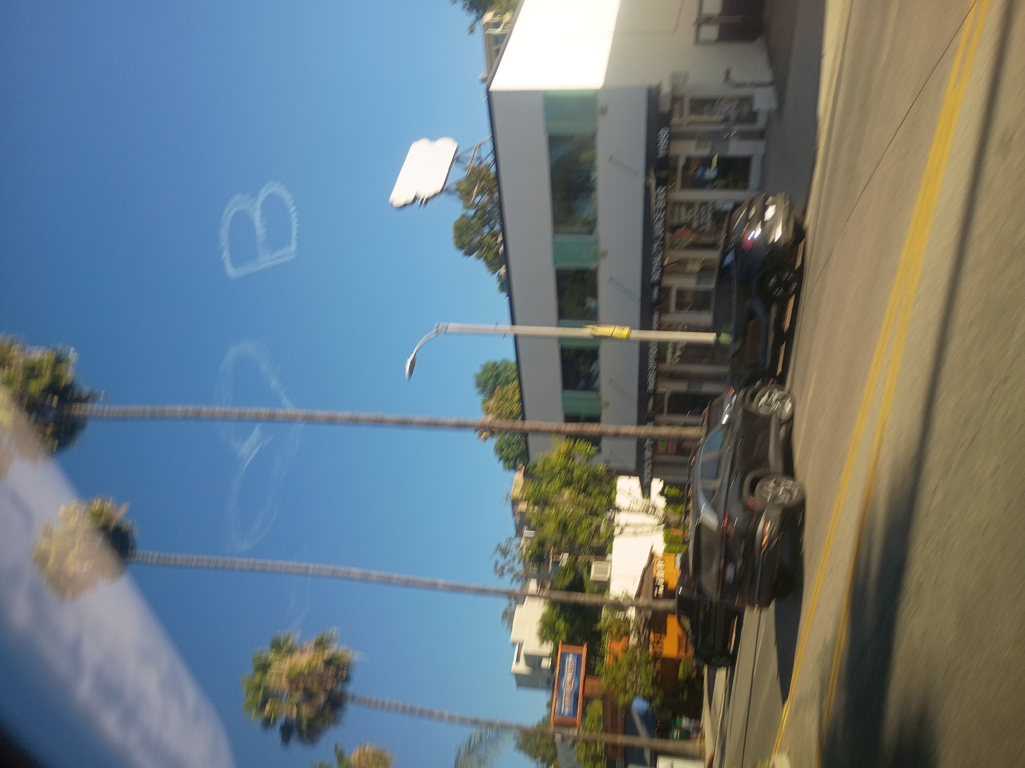 Sunny LA street scene shot wide with motion blur