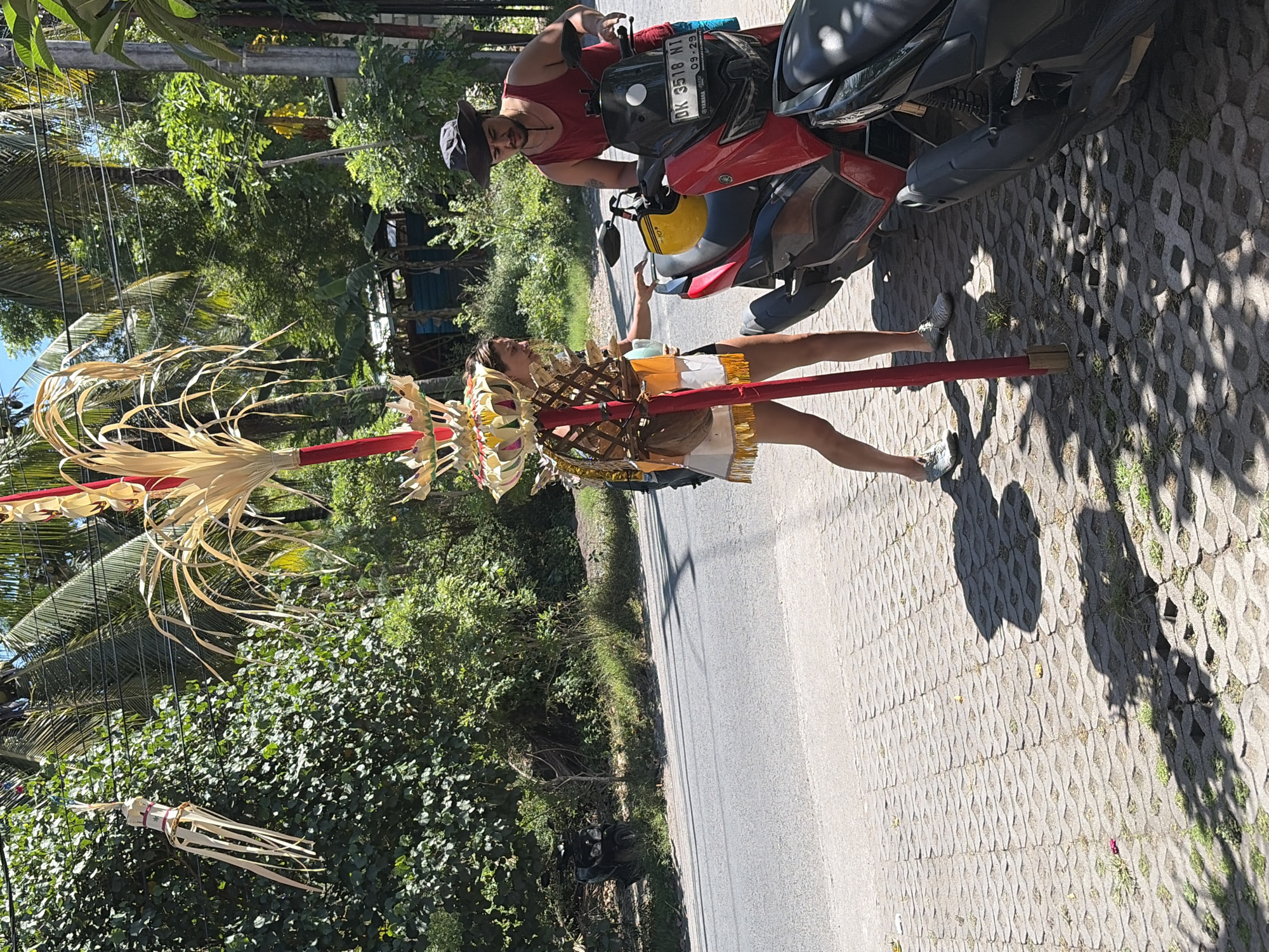 Roadside moment with a red motorcycle in Nusa Penida