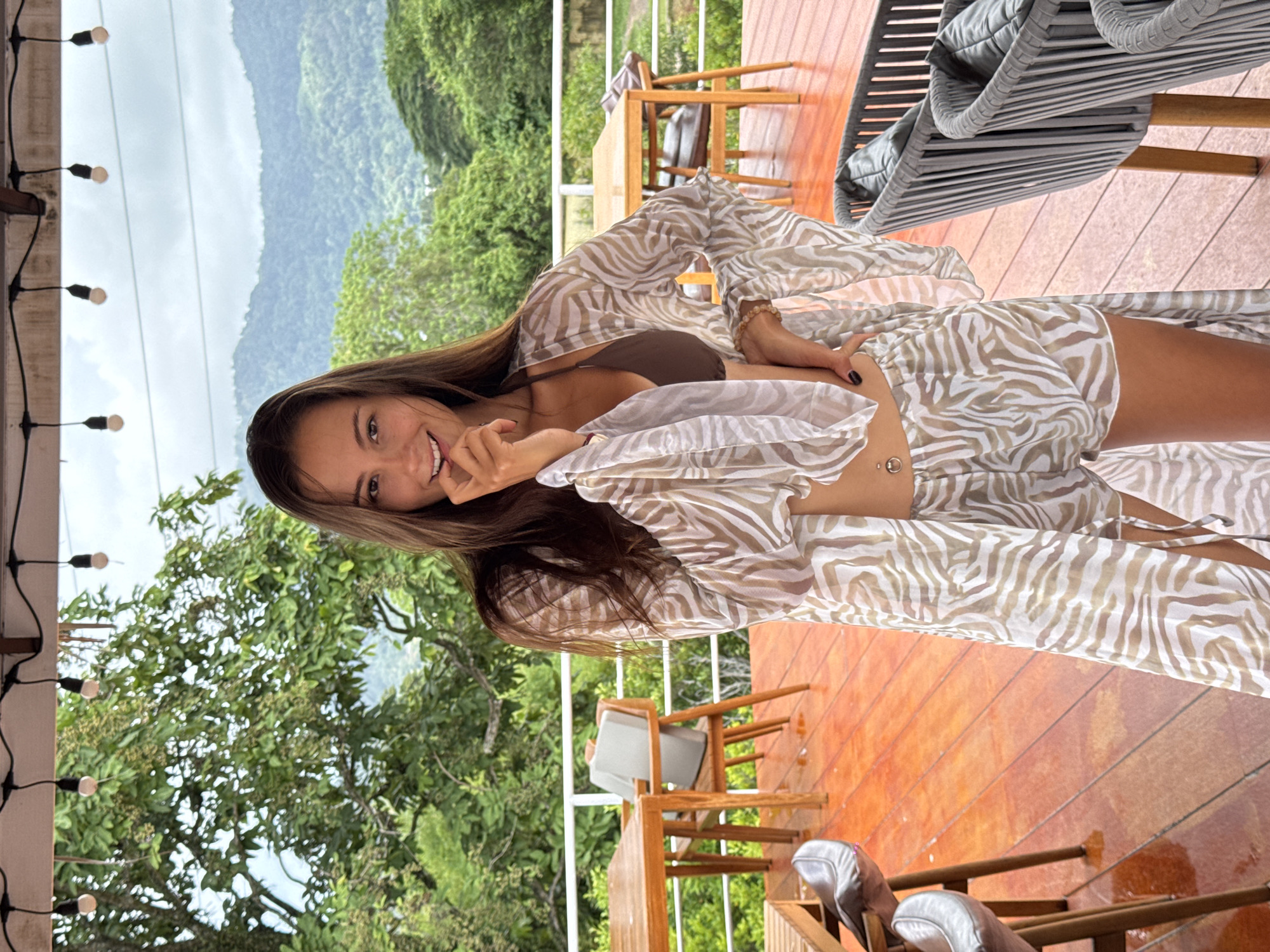 Woman poses on deck in Kathu, Thailand