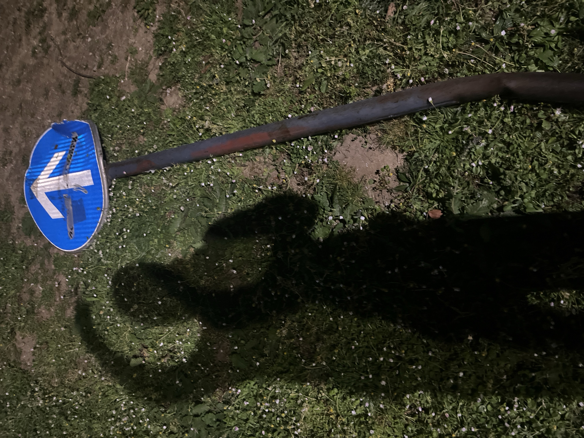 Broken directional road sign found on ground in Budva