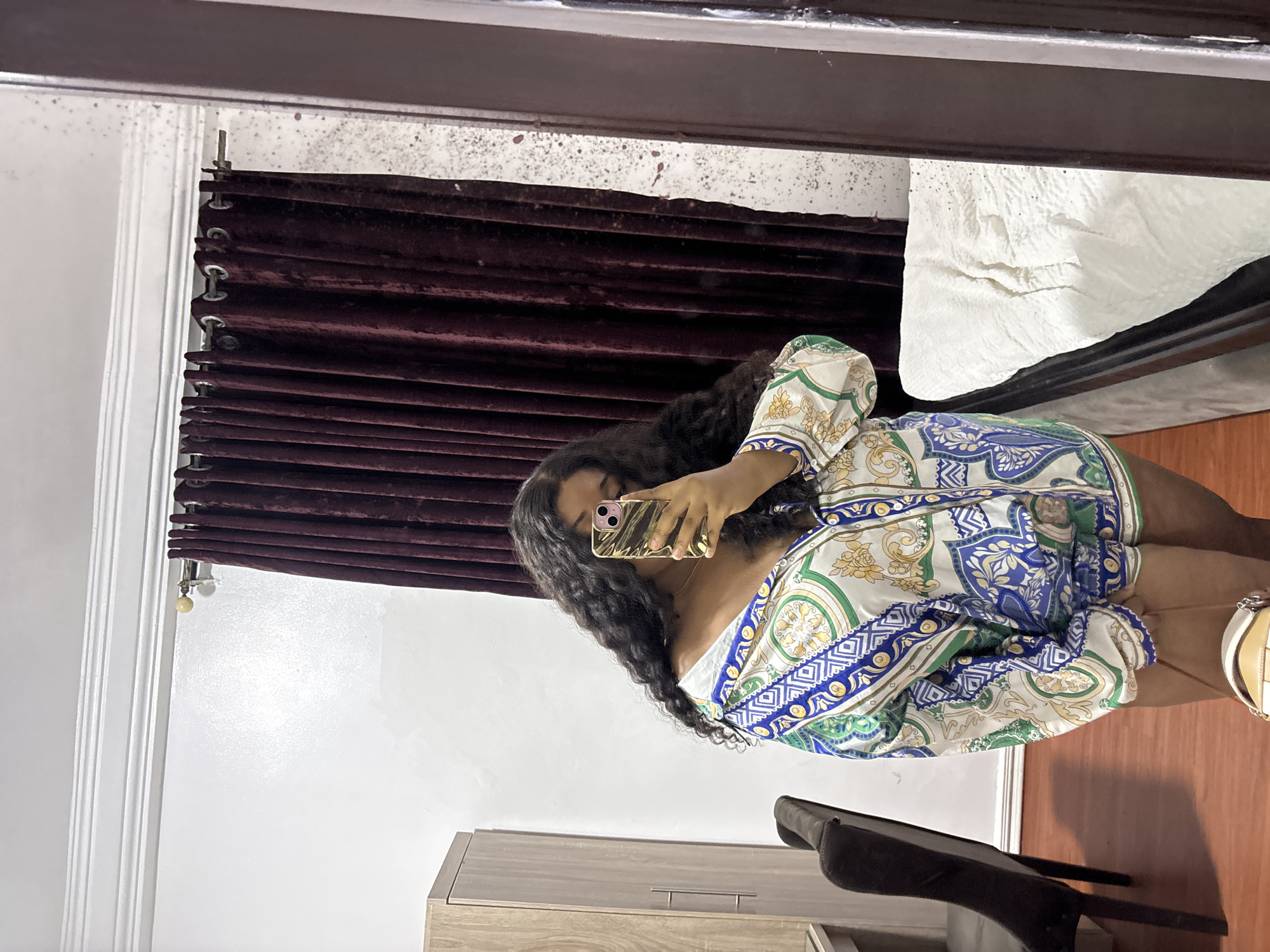 Woman takes selfies in Port Harcourt room