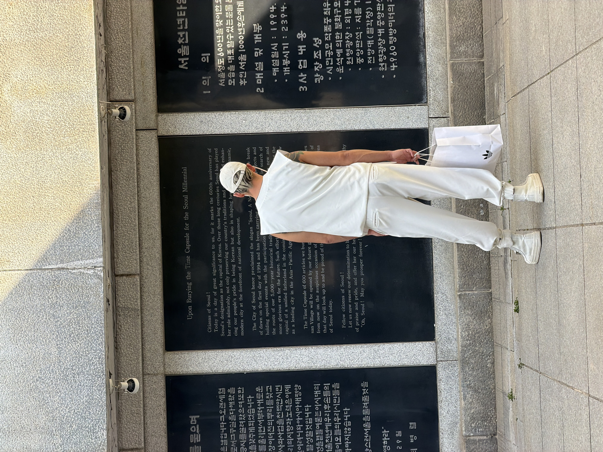 White-clad visitor tours Seoul memorial site Sunday morning
