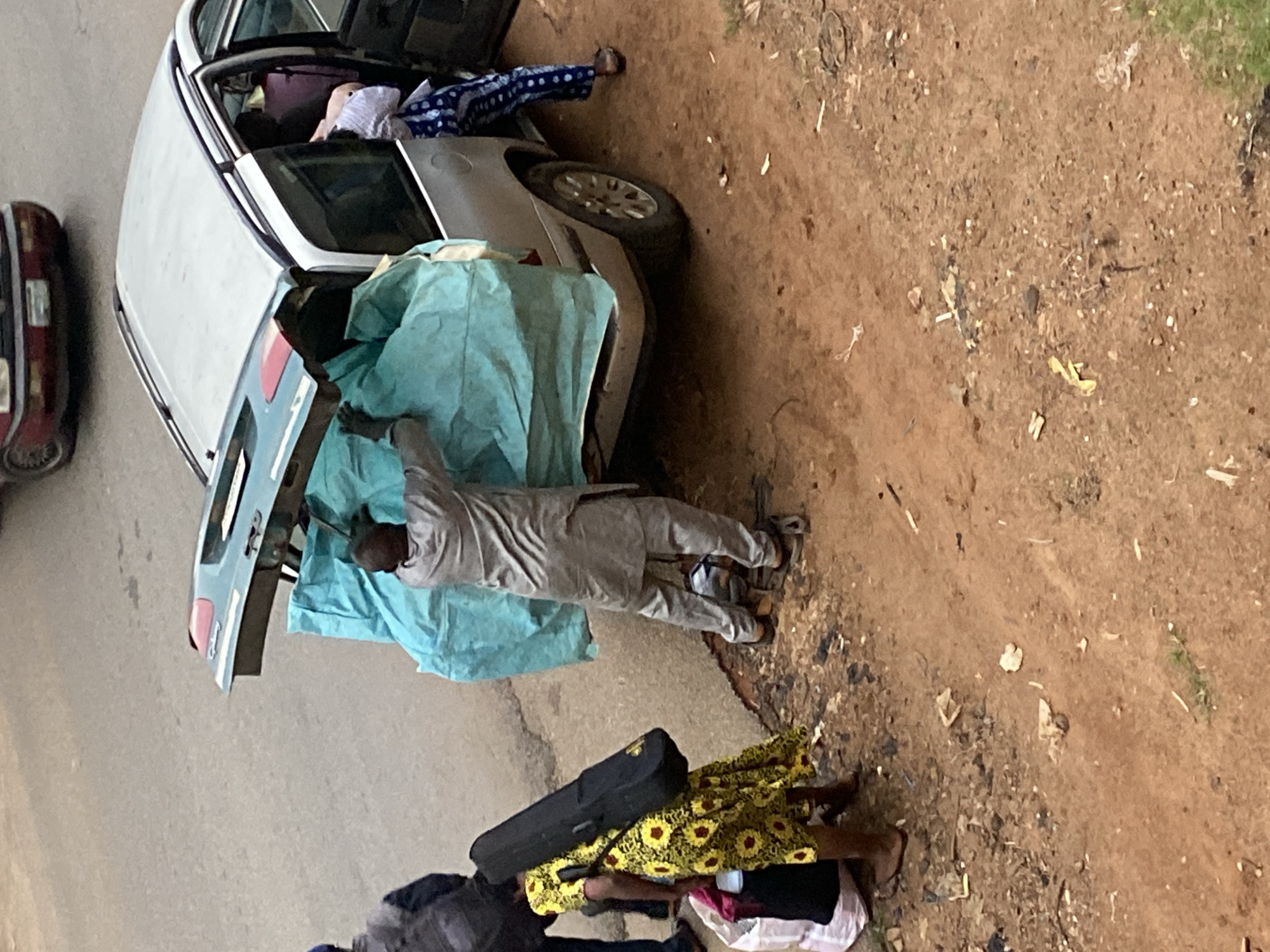 Bags packed, people moving — a busy departure scene in Bukuru