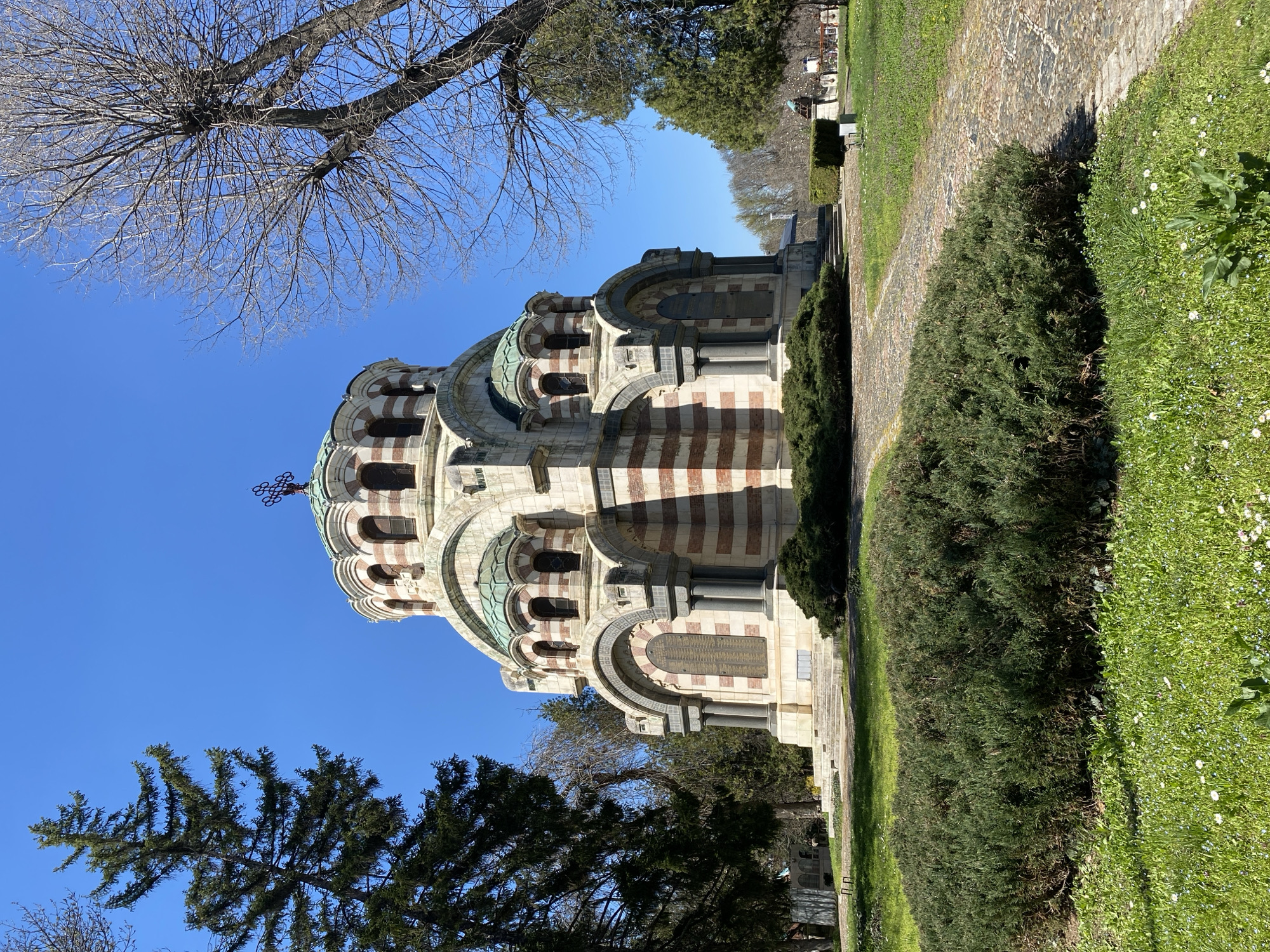 Tourist photographs historic mausoleum in Pleven, Bulgaria