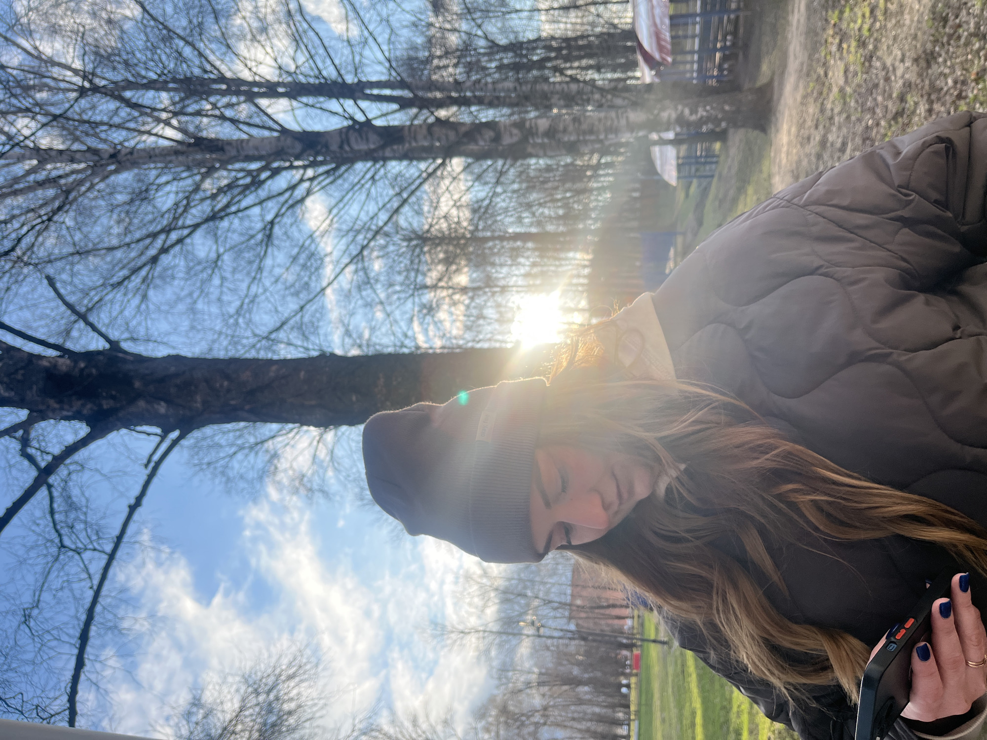 Woman takes selfies at park and waterfall in Klin