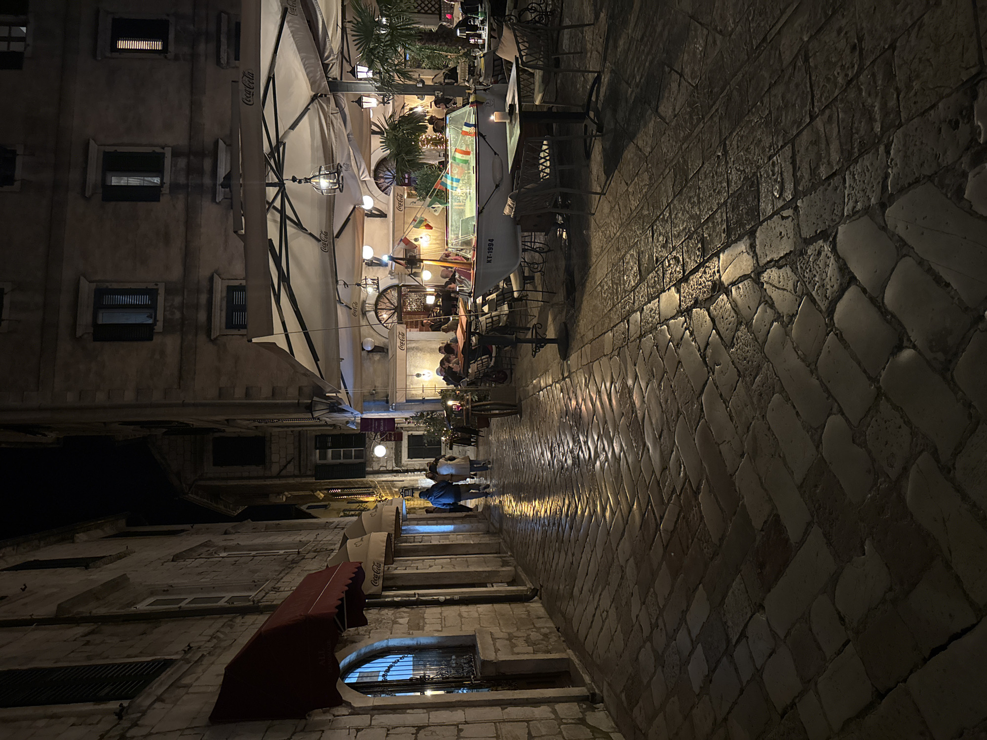 Evening cafe life documented in Kotor's old town