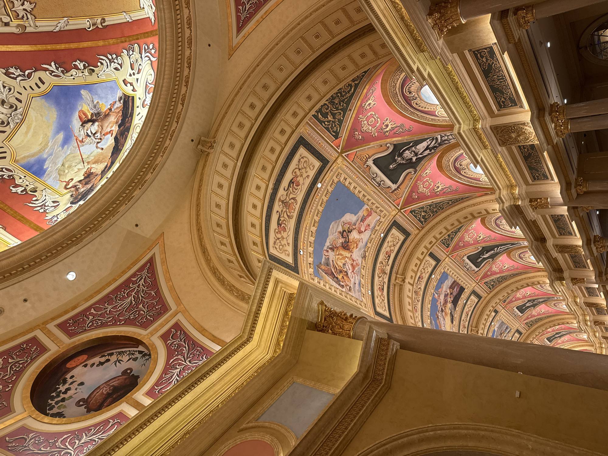 Tourist documents ornate Macao interiors, enjoys Starbucks coffee