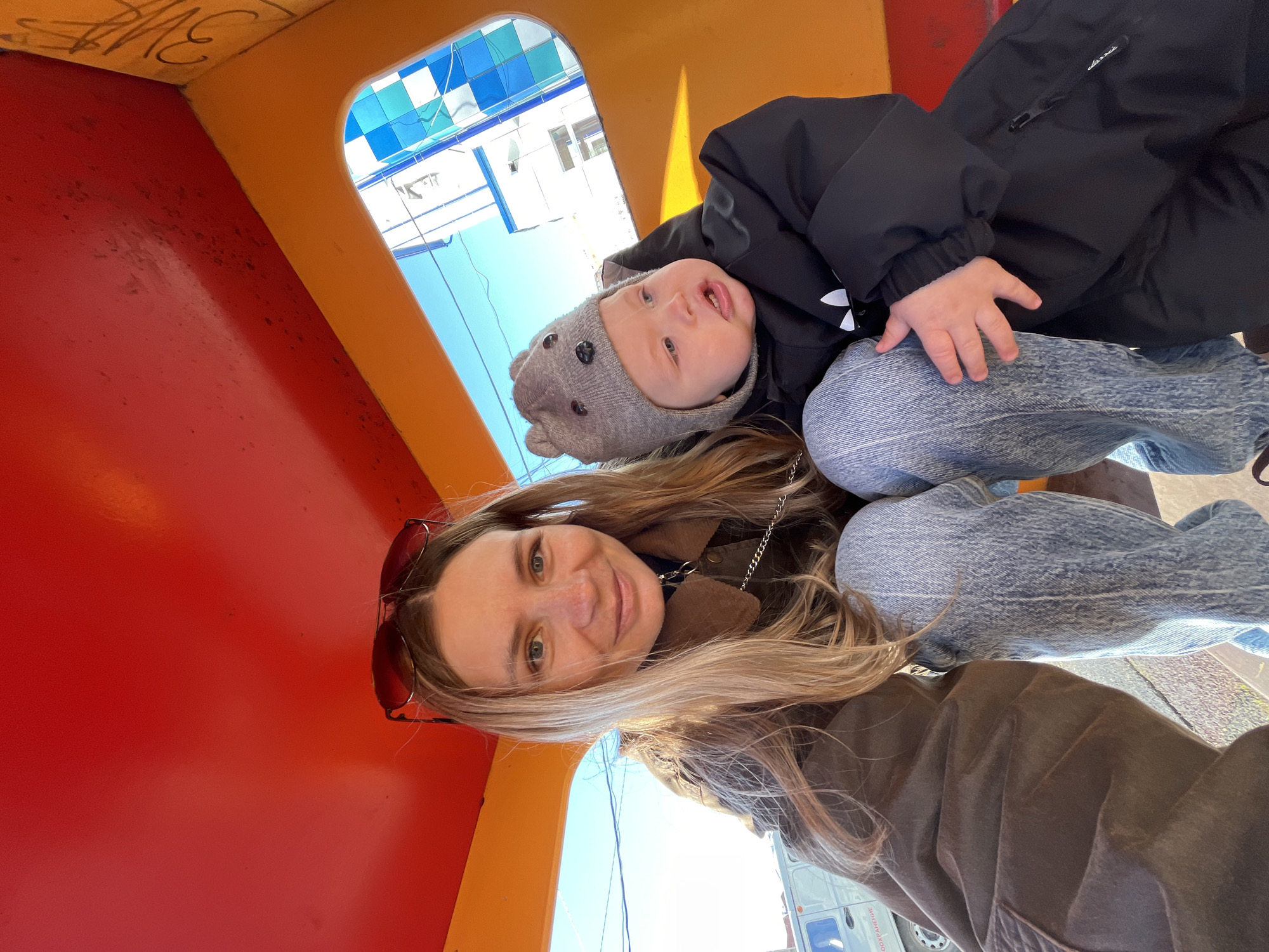Mother and baby enjoy playground visit in Chaikovsky, Russia