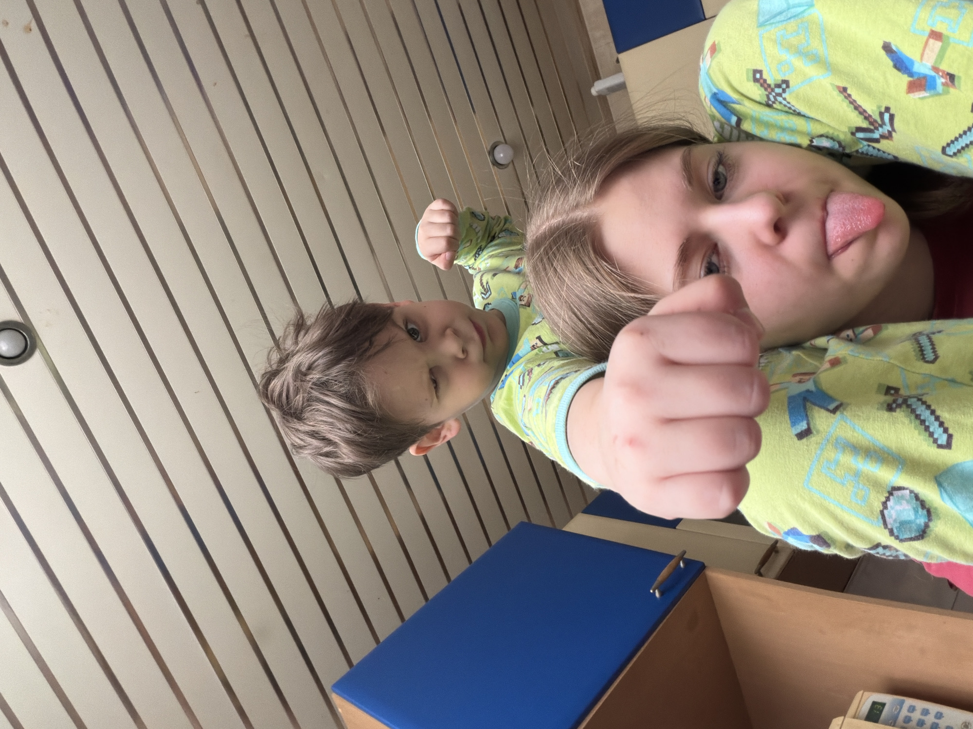 Children in Minecraft pajamas play for camera in Perm
