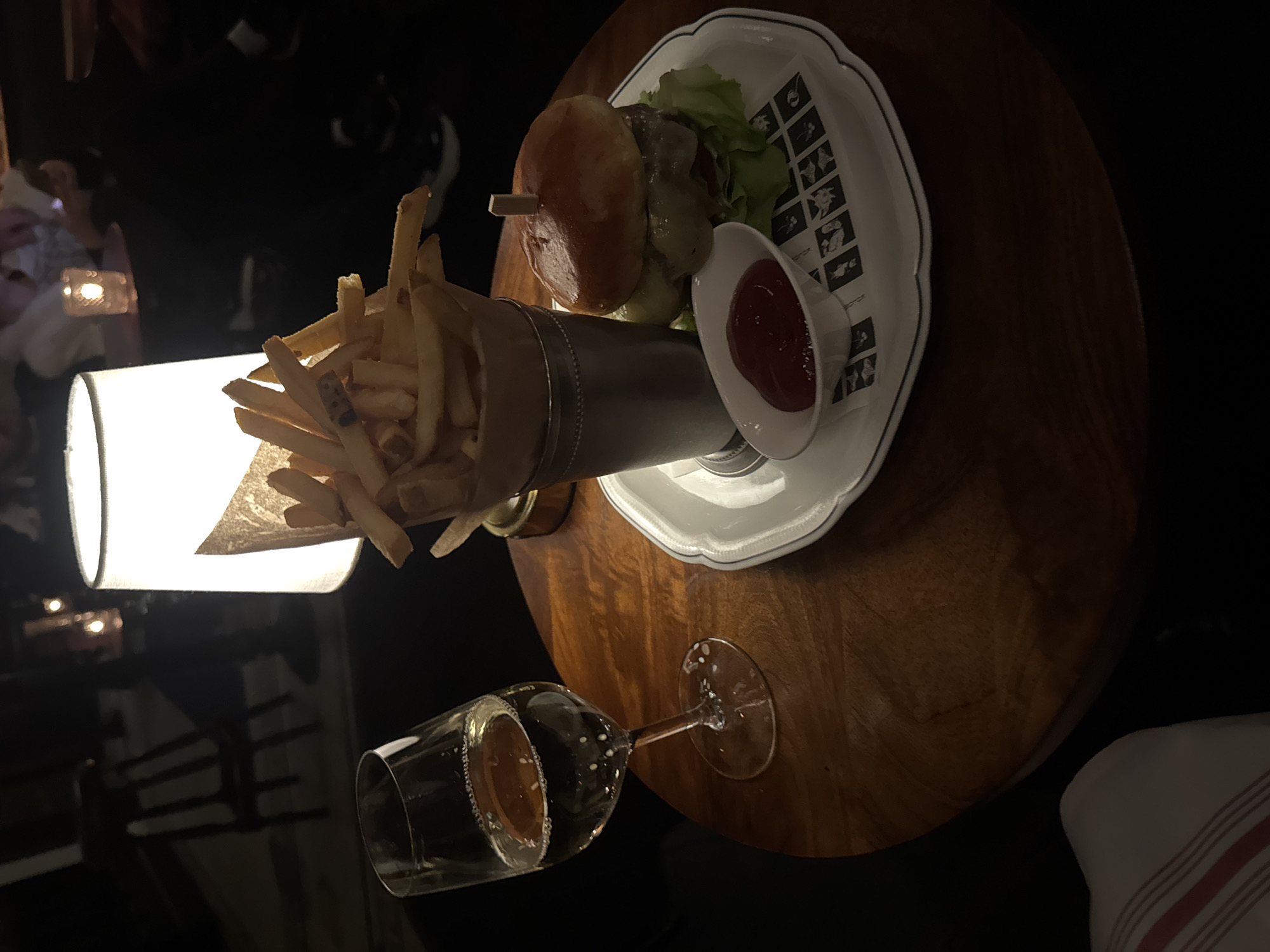 Late-night burger meal documented at New York table