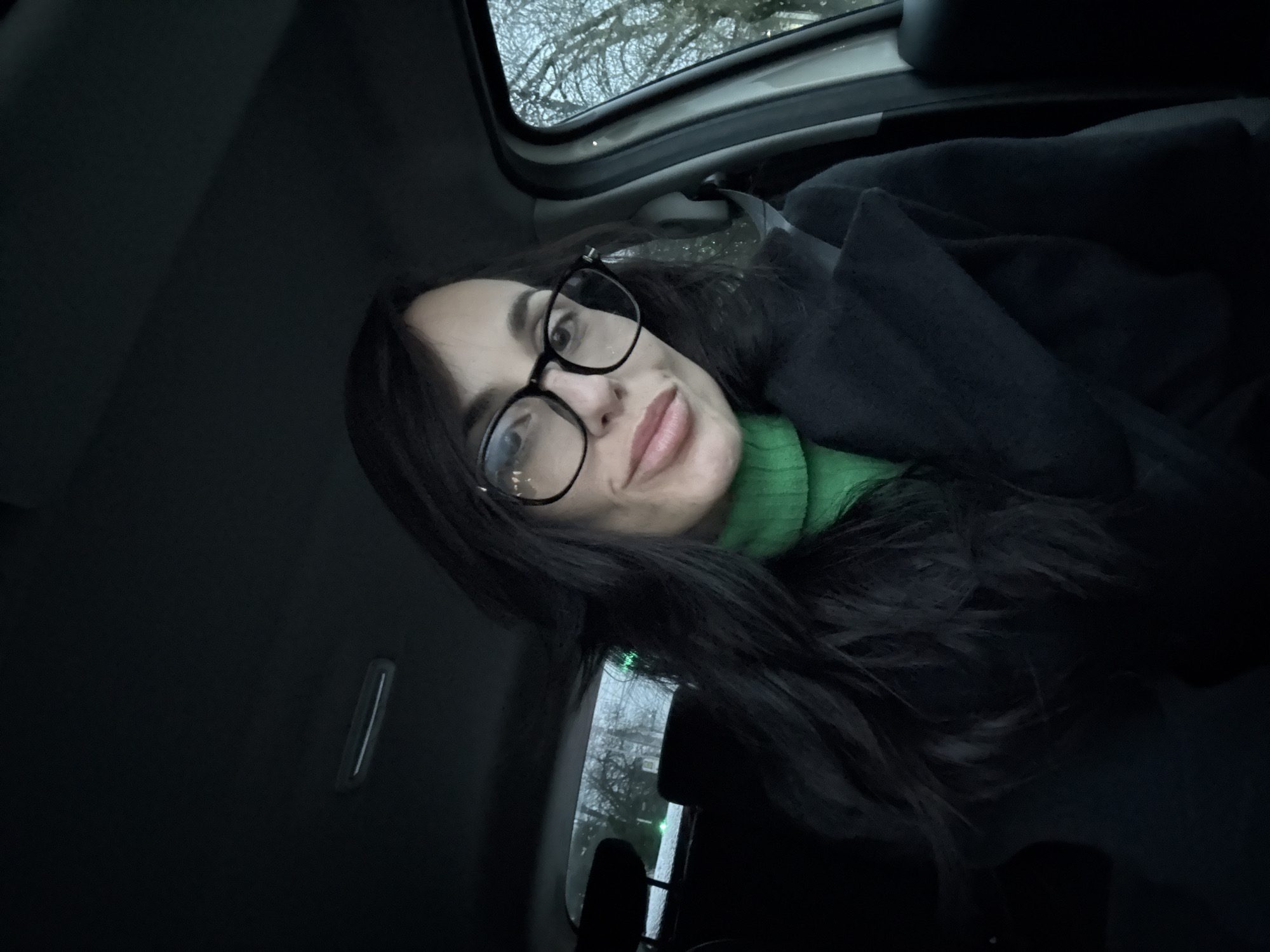 Woman in green sweater observed in car in Pleven
