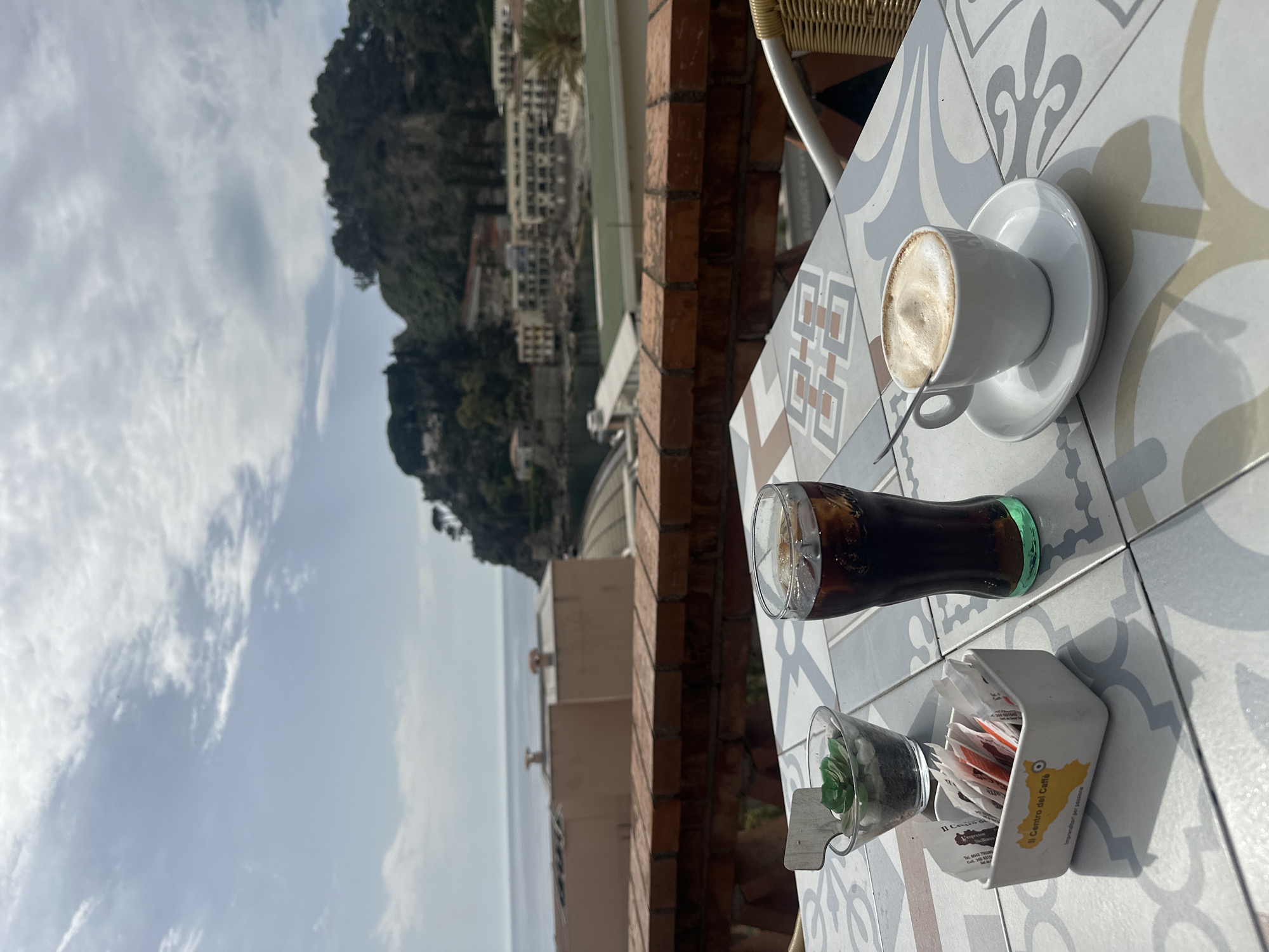 Morning café moment captured in Taormina, Italy