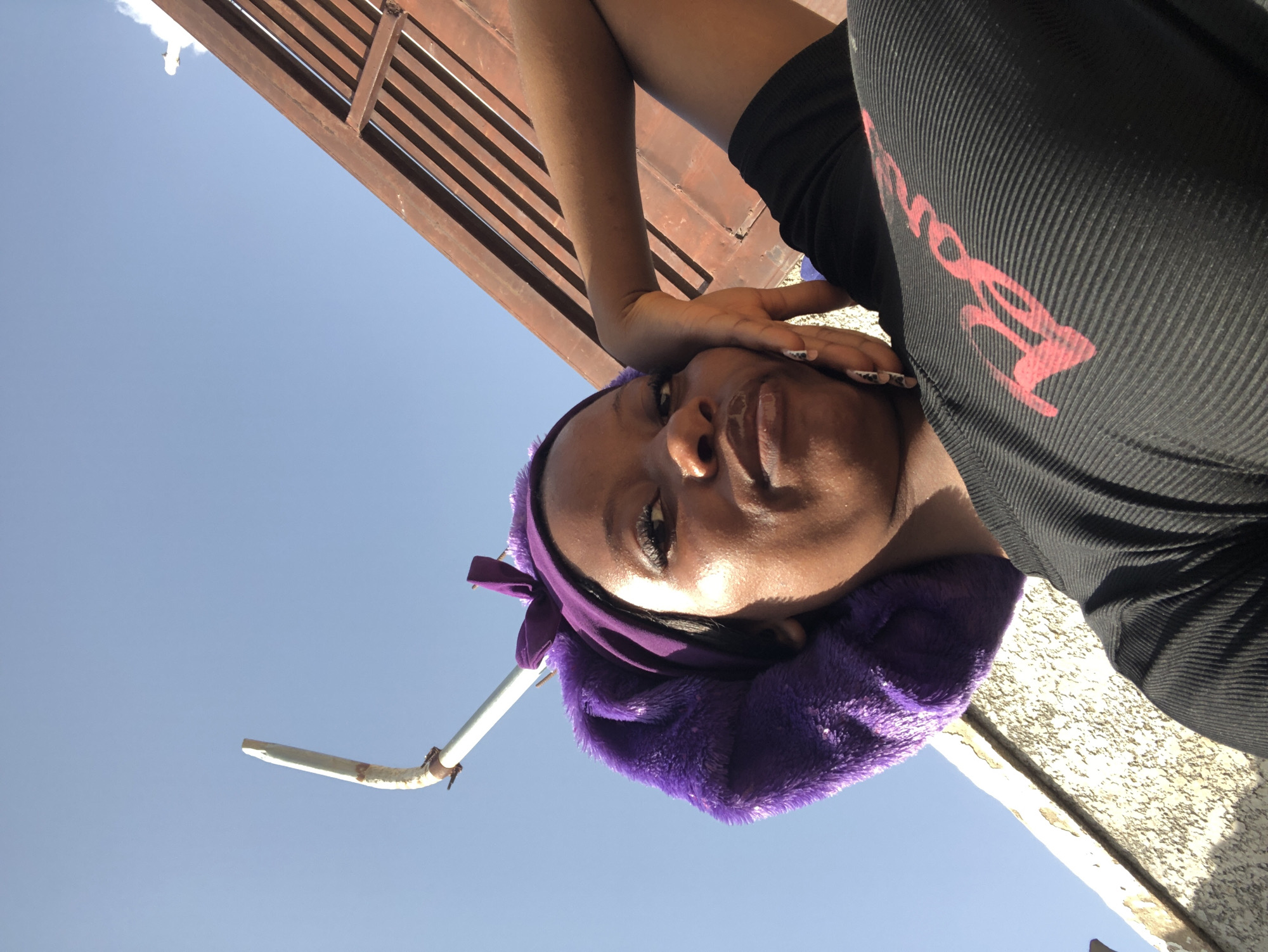 Afternoon selfie session outdoors in Nigeria, purple bonnet series