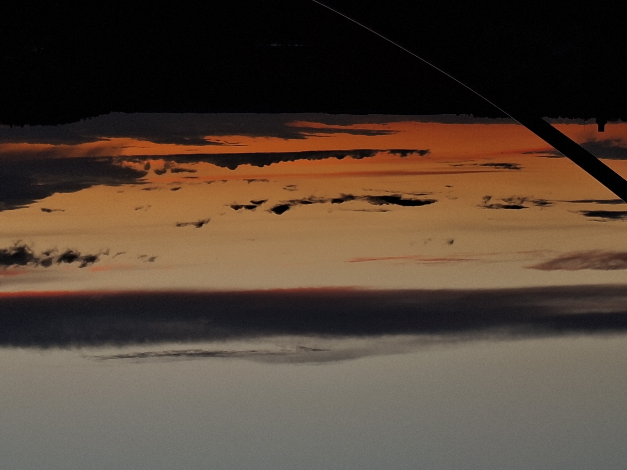 Dramatic sky conditions observed from aircraft over Karsha, Russia