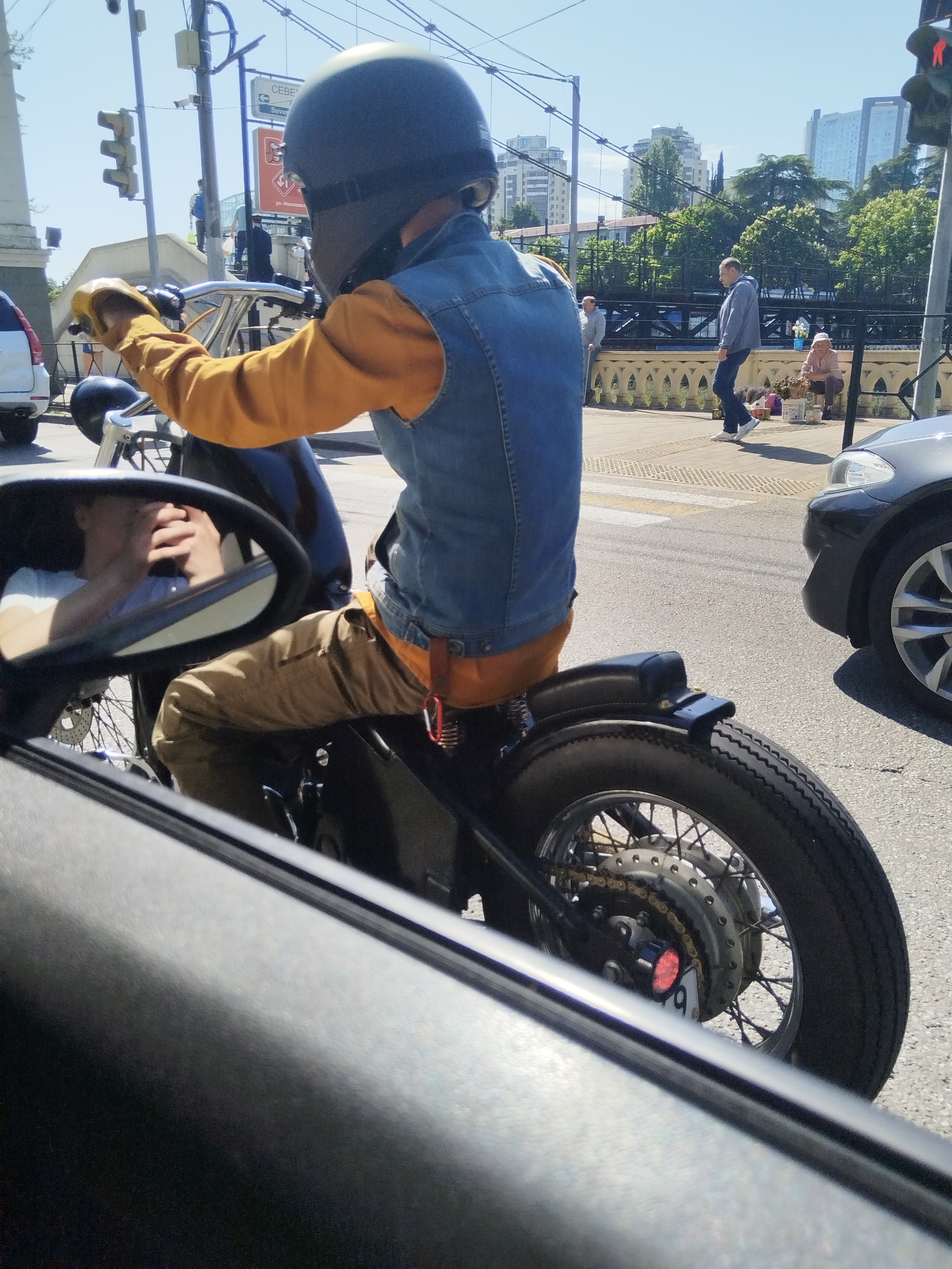 Motorcyclist in denim vest spotted on Sochi street