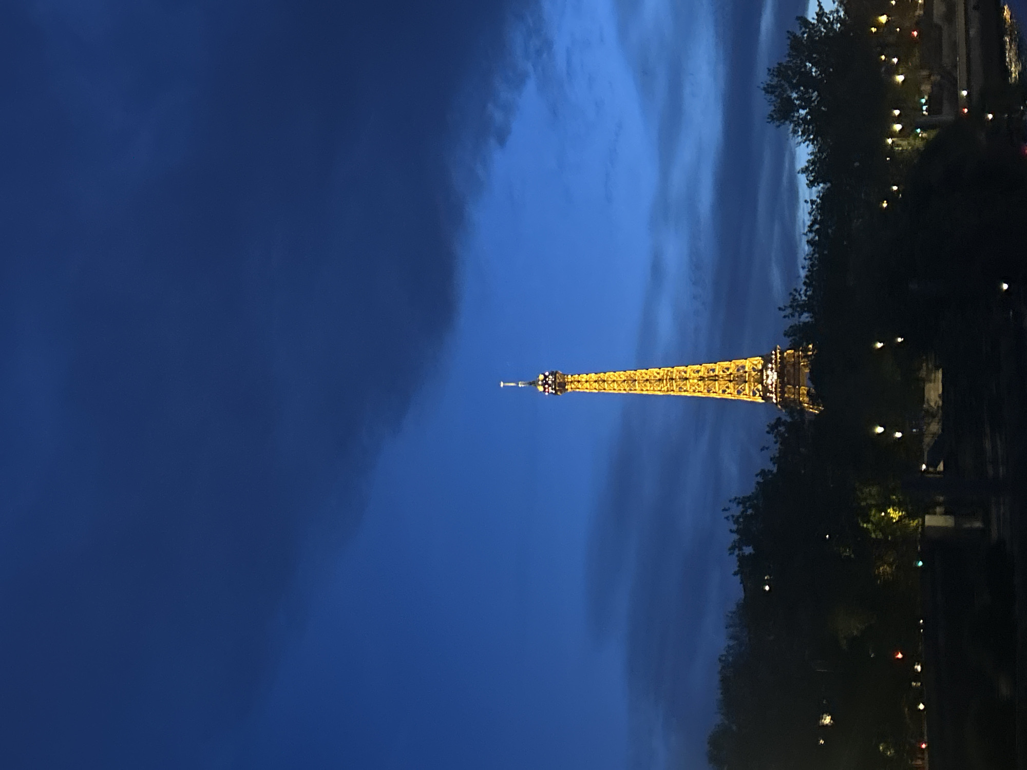 Eiffel Tower illuminated at evening twilight in Paris