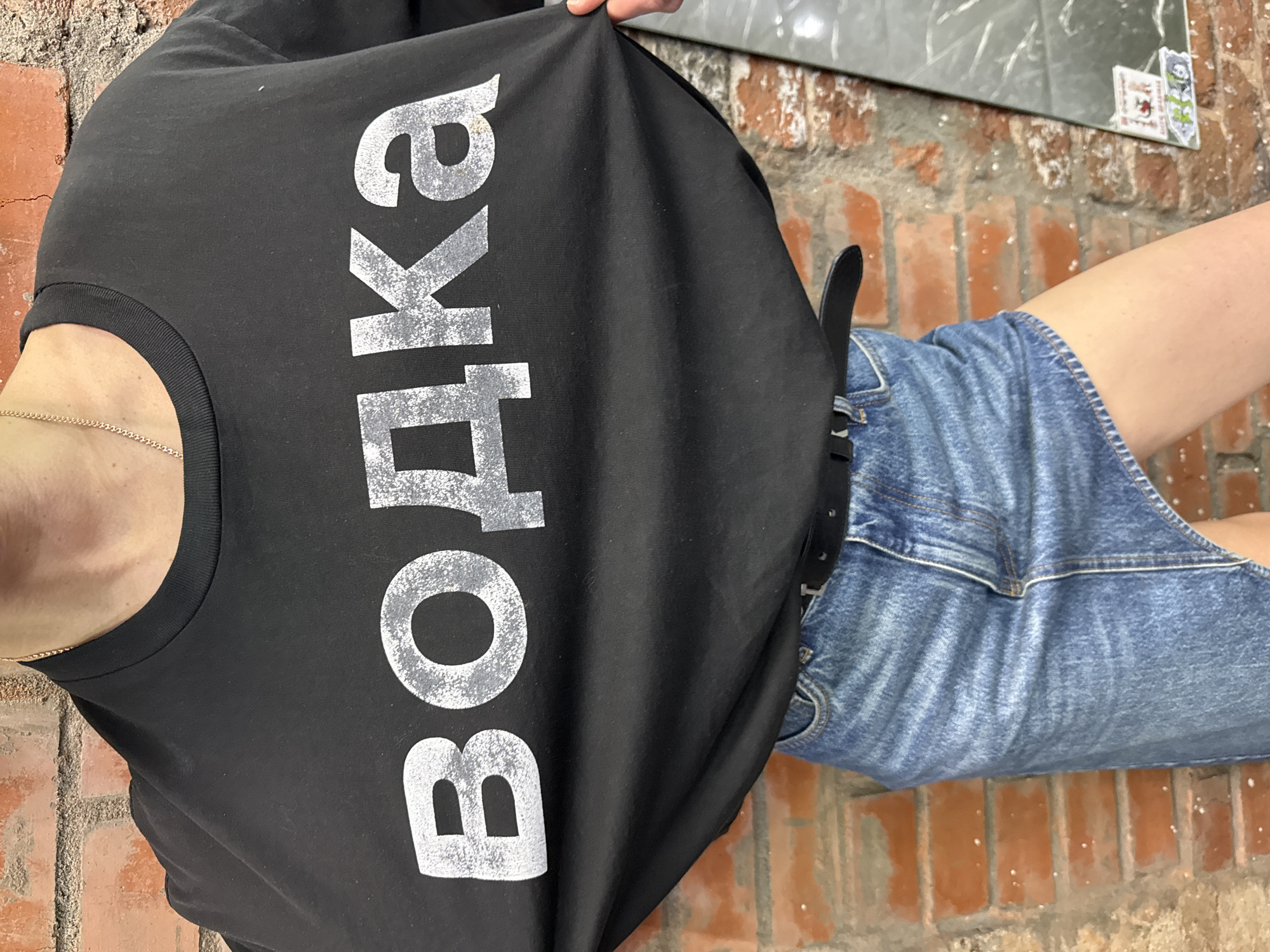 Woman spotted wearing vodka-themed shirt in Moscow