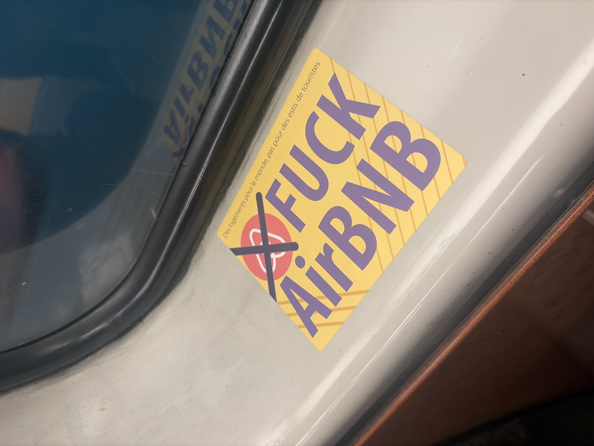 Anti-Airbnb sticker spotted on Longueuil public transit
