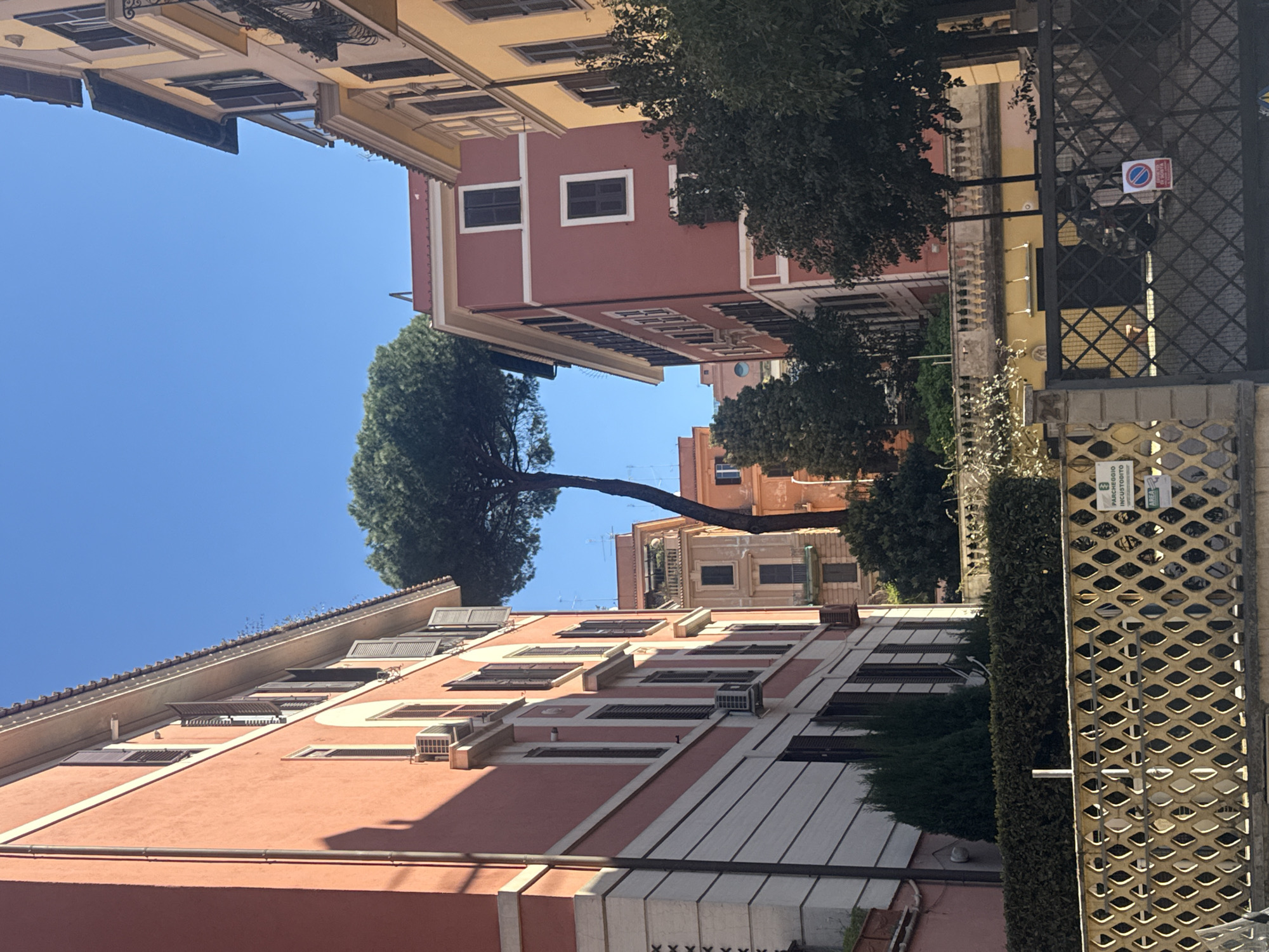 Morning street scene captured in historic Rome neighborhood